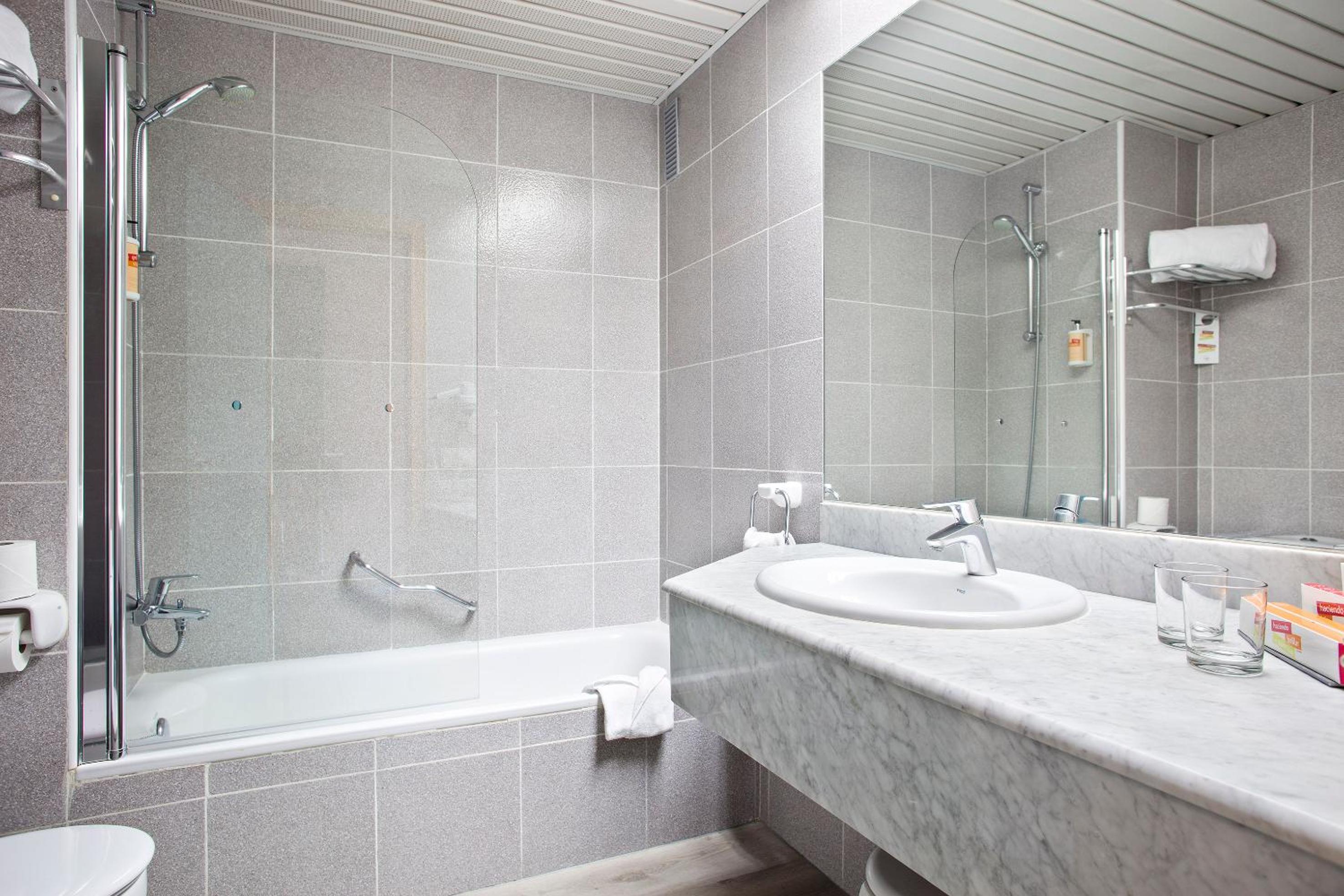 Relax in this modern, stylish bathroom oasis.
