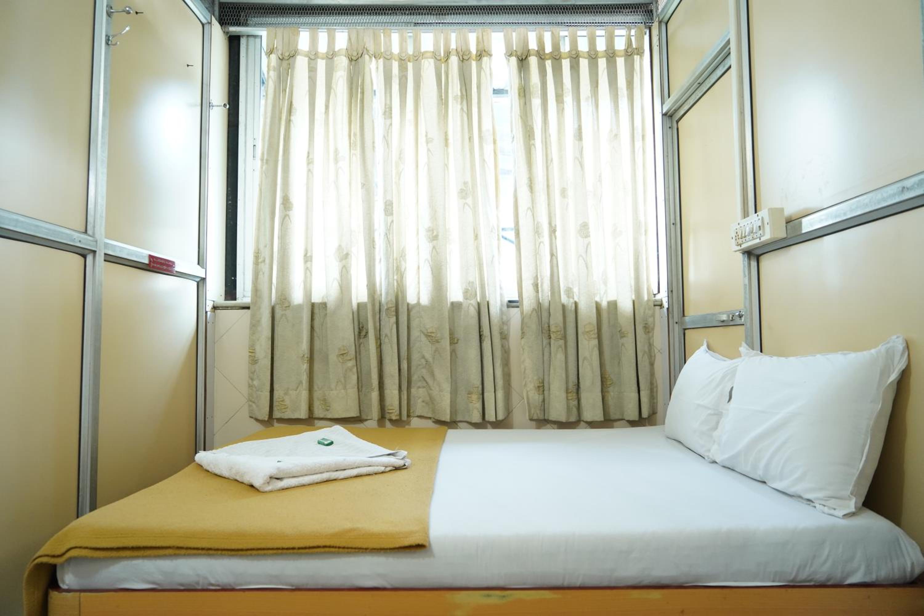 Single Bed In Dormitory Room