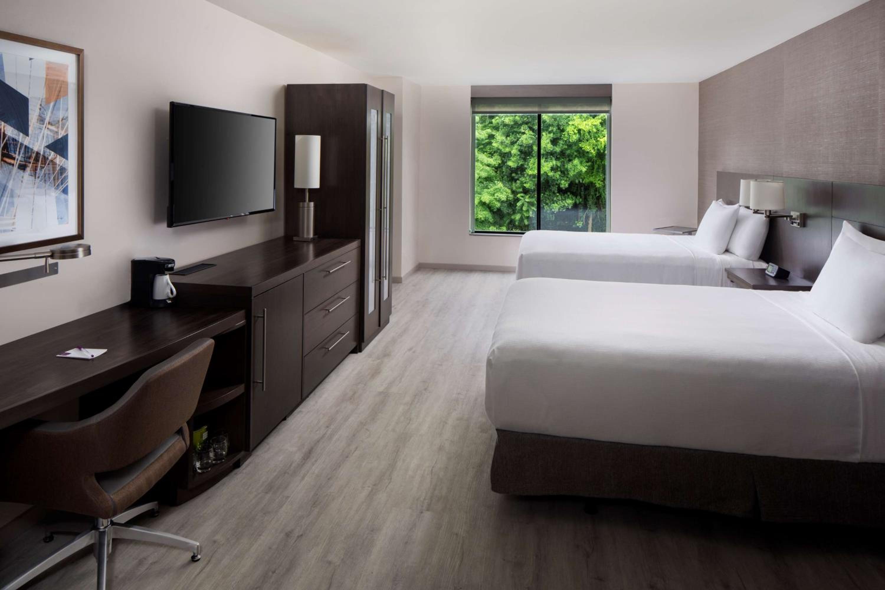 Queen Room with Two Queen Beds and Sofa Bed - Photo 4