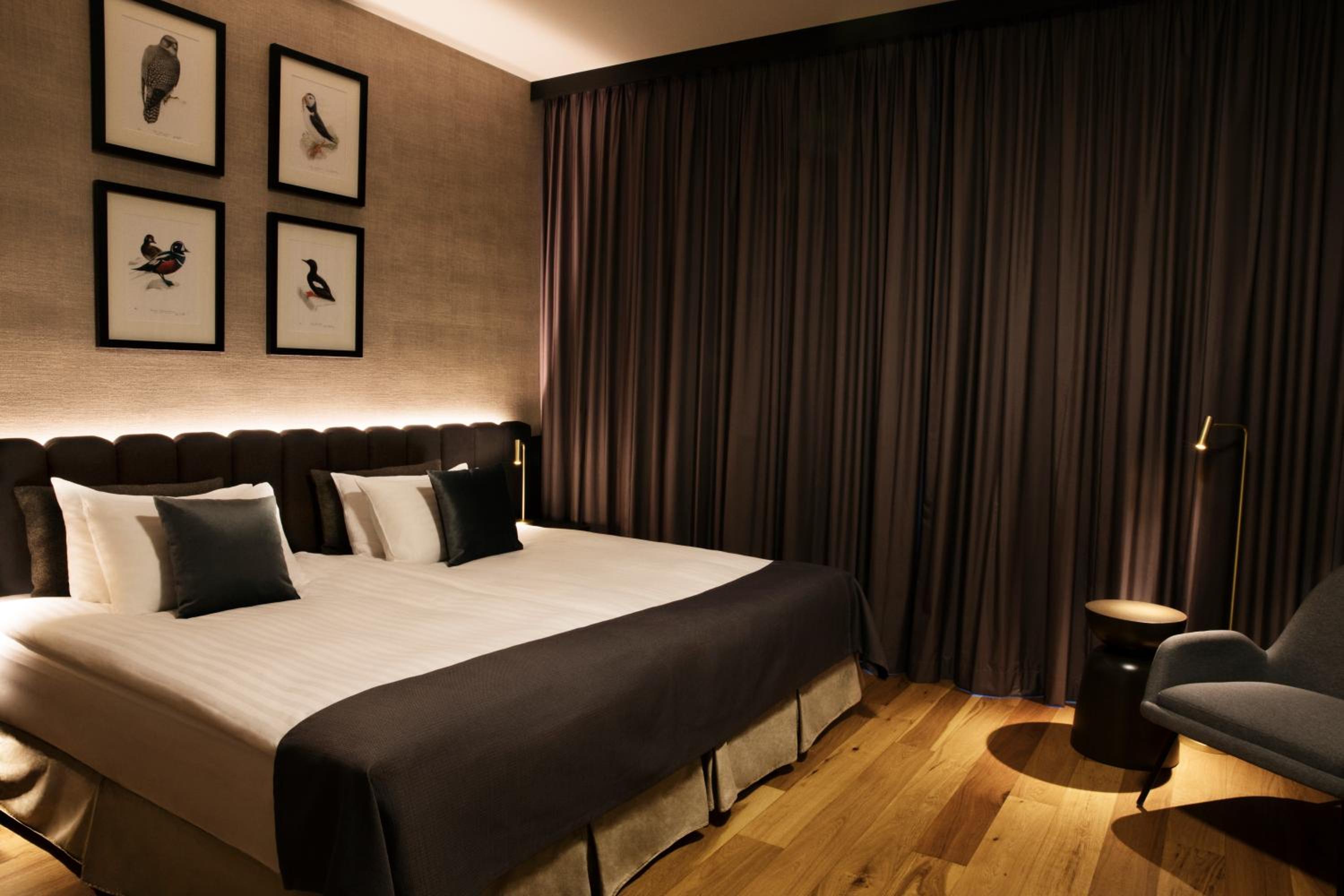 Experience comfort in a stylish and serene hotel room.