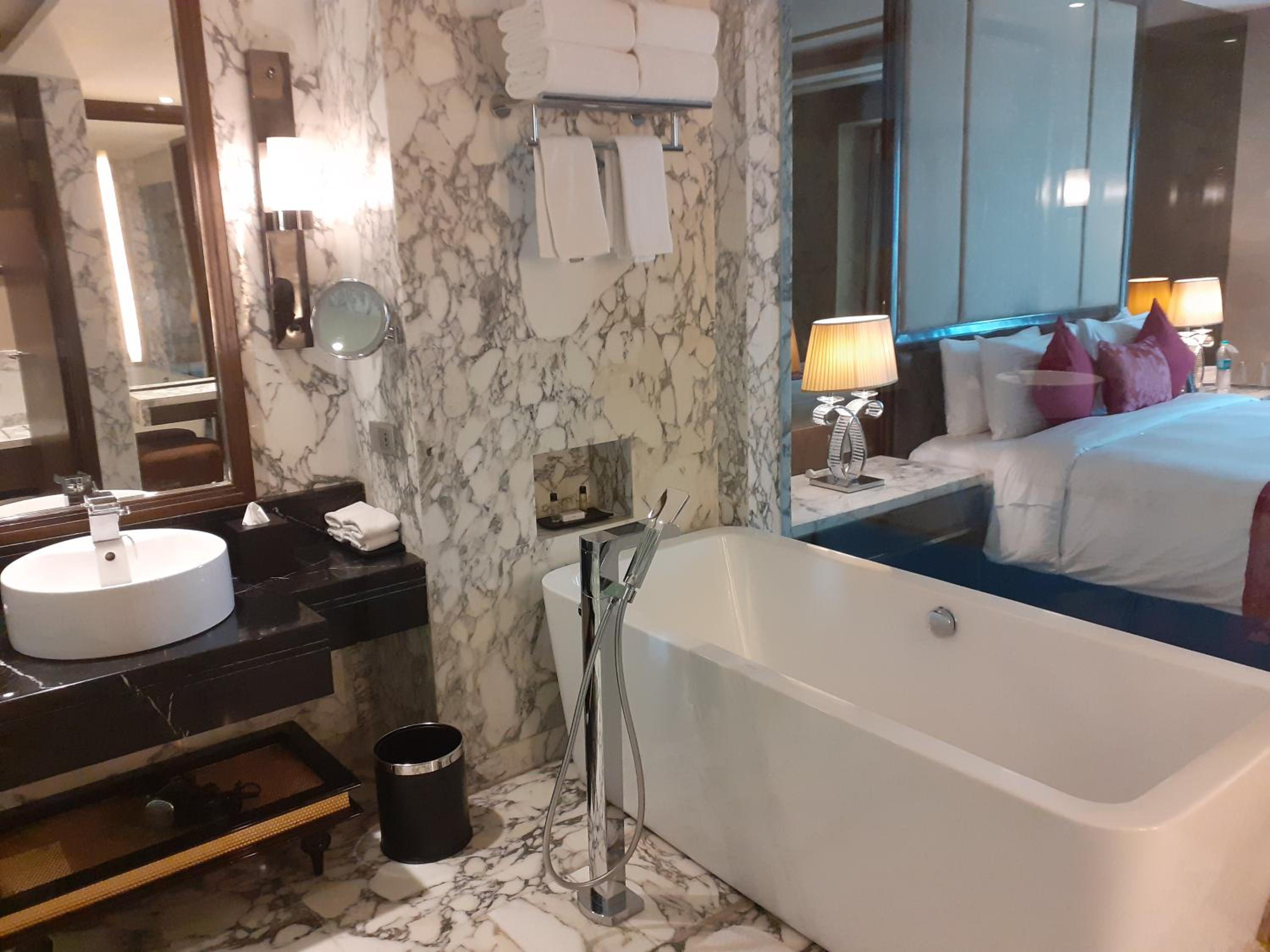 Suite with Bathtub and Living Room – Non Smoking Room with 02 beer or 02 Pegs(IMFL) or 02 Mocktails and 02 pcs laundry, Complimentary INR 500 Hotel Credit on min usage of INR 2000 at market place restaurant on Food & Soft Beverages, 50% off on Mini Bar Suite with Bathtub and Living Room – Non Smoking Room with 02 beer or 02 Pegs(IMFL) or 02 Mocktails and 02 pcs laundry, Complimentary INR 500 Hotel Credit on min usage of INR 2000 at market place restaurant on Food & Soft Beverages, 50% off on Mini Bar