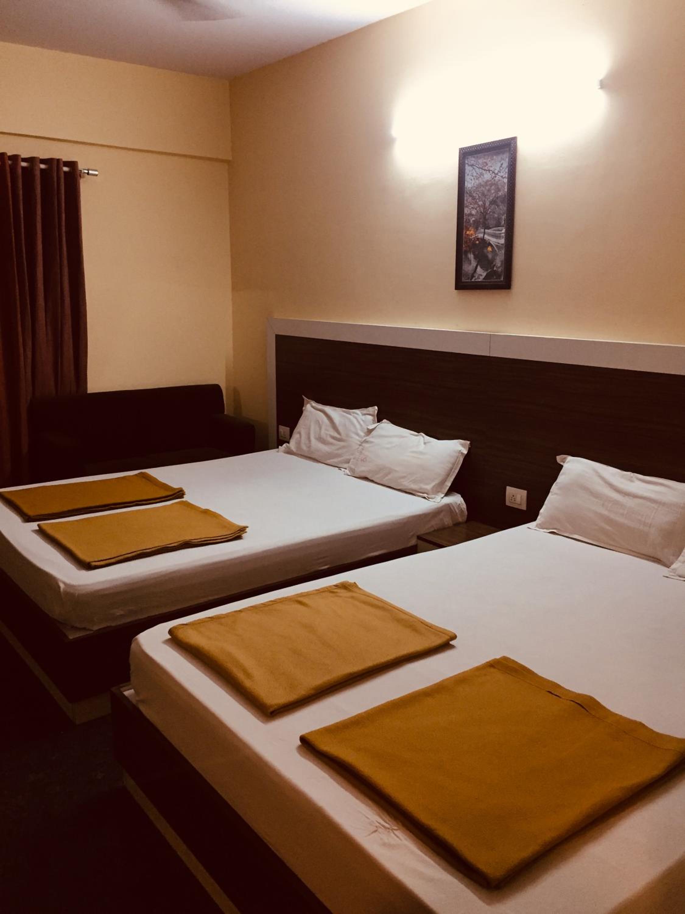 Deluxe Queen Room with Two Queen Beds - Photo 1