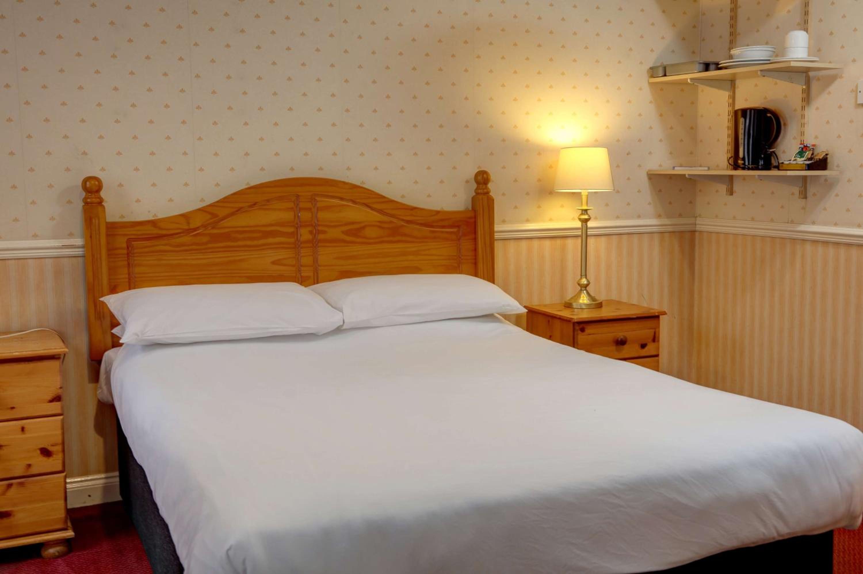Economy room with double bed and internal window to hall