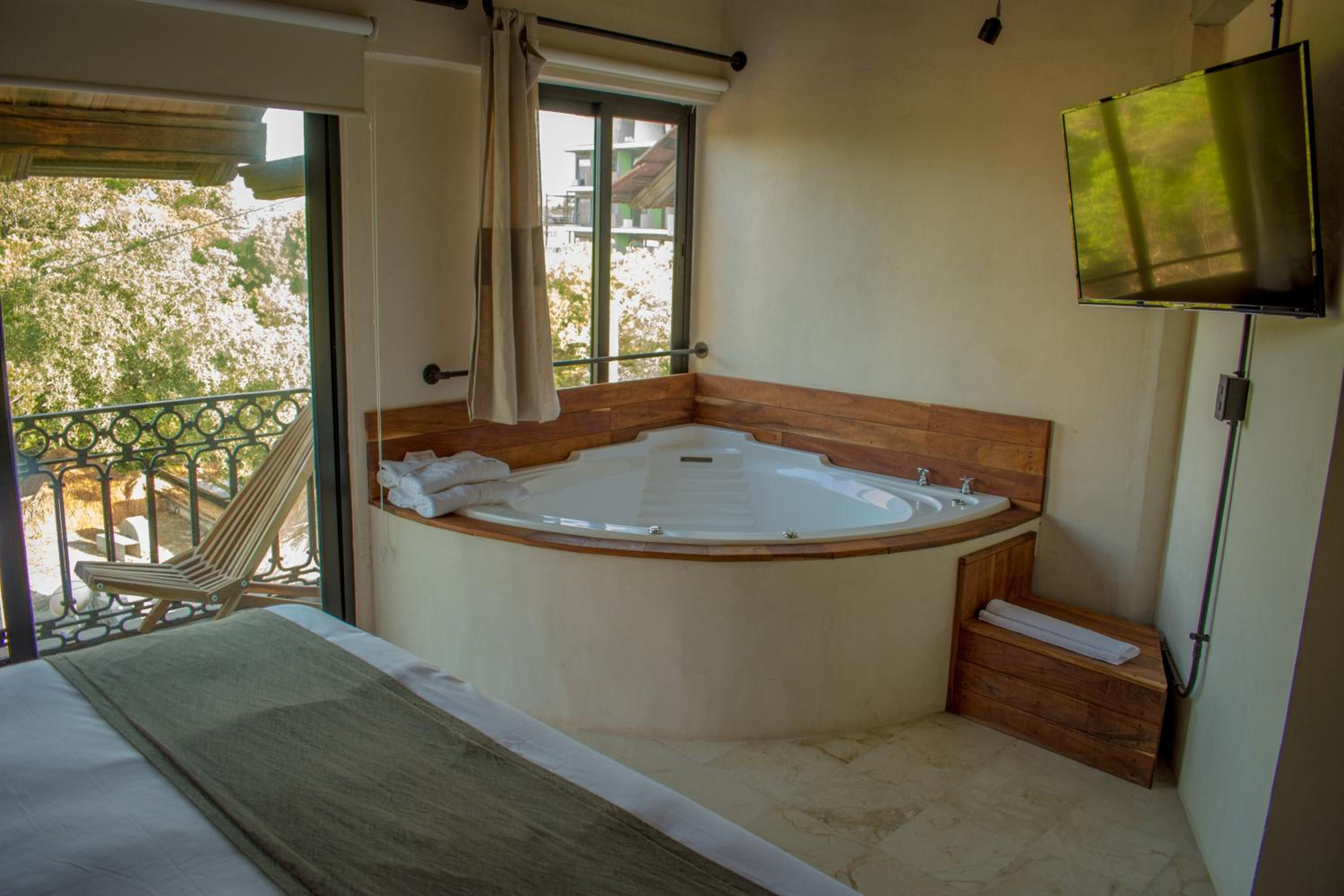 Master Suite with Jacuzzi, Balcony and City Views - Photo 8