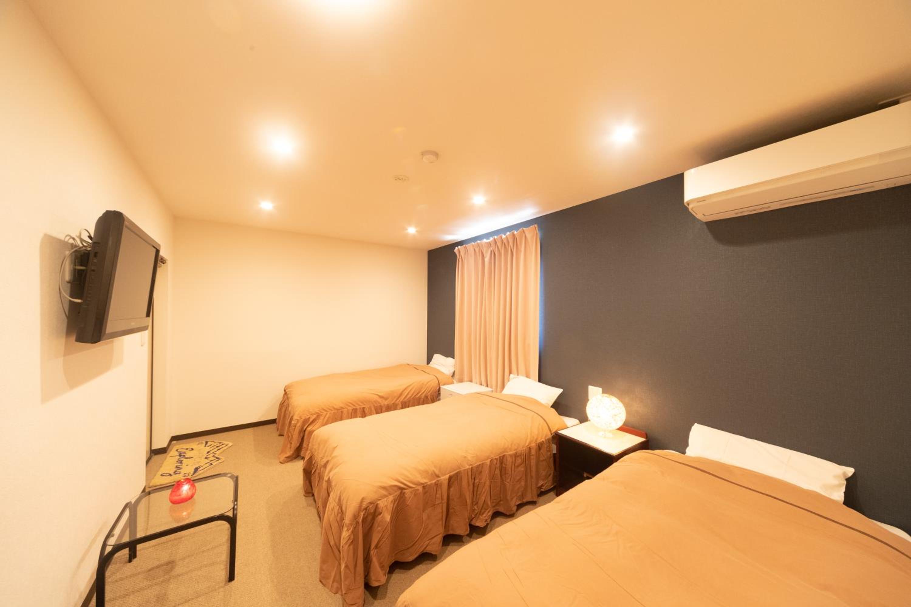 Renovated Triple Room with Private Shower Room and toilet photo 1
