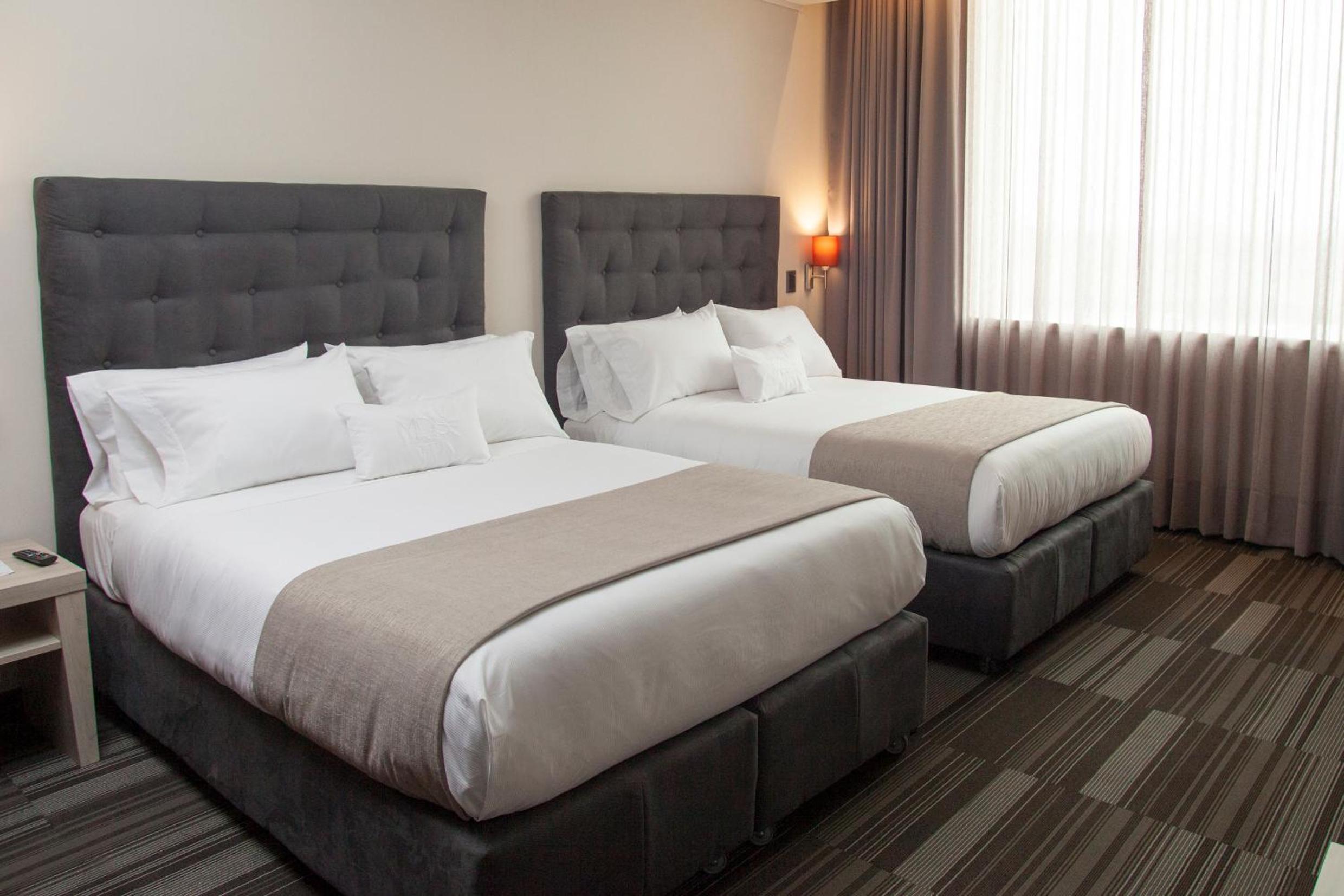Standard Queen Room with Two Queen Beds photo 1