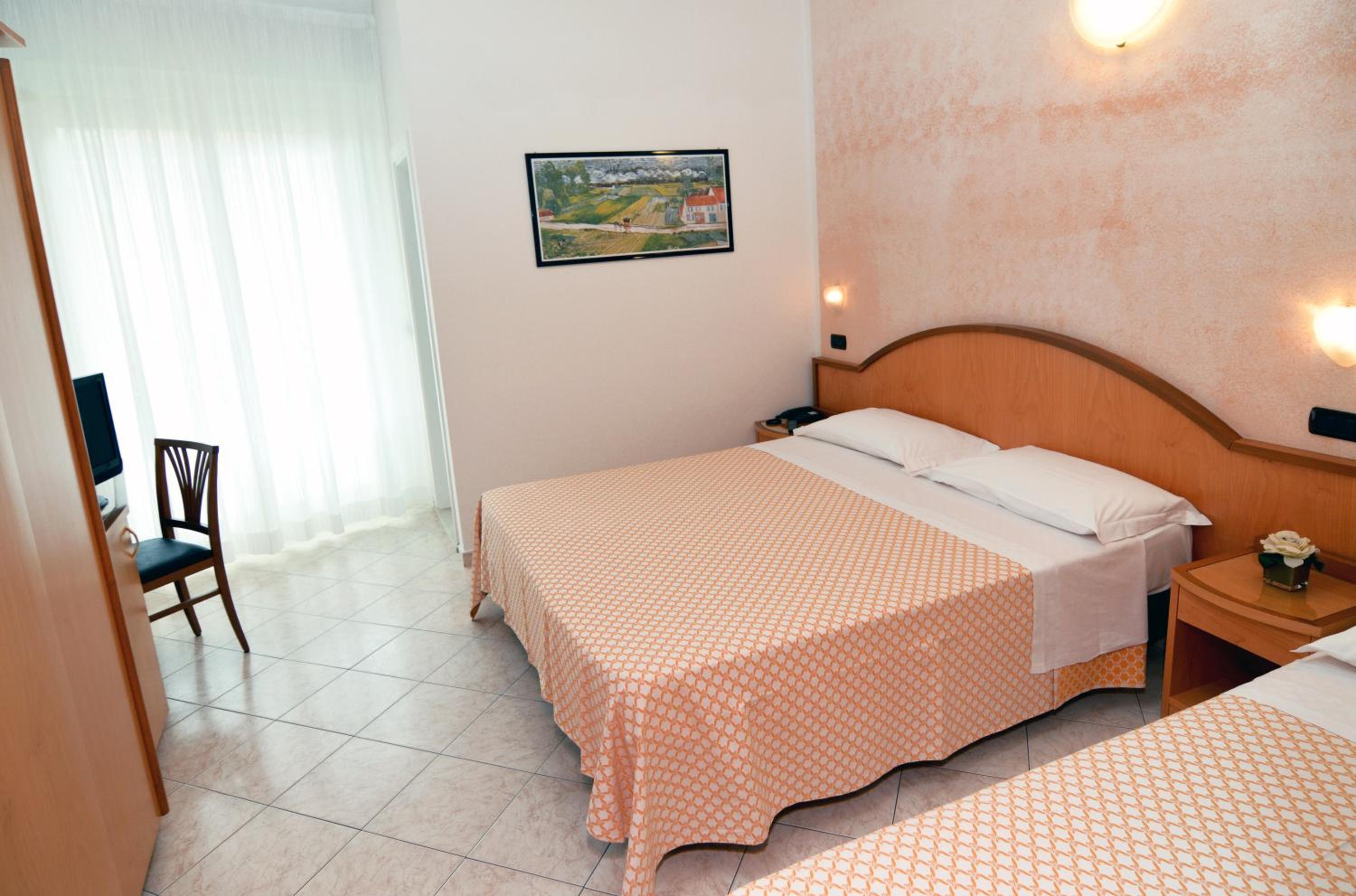 Quarto Triplo com Varanda.