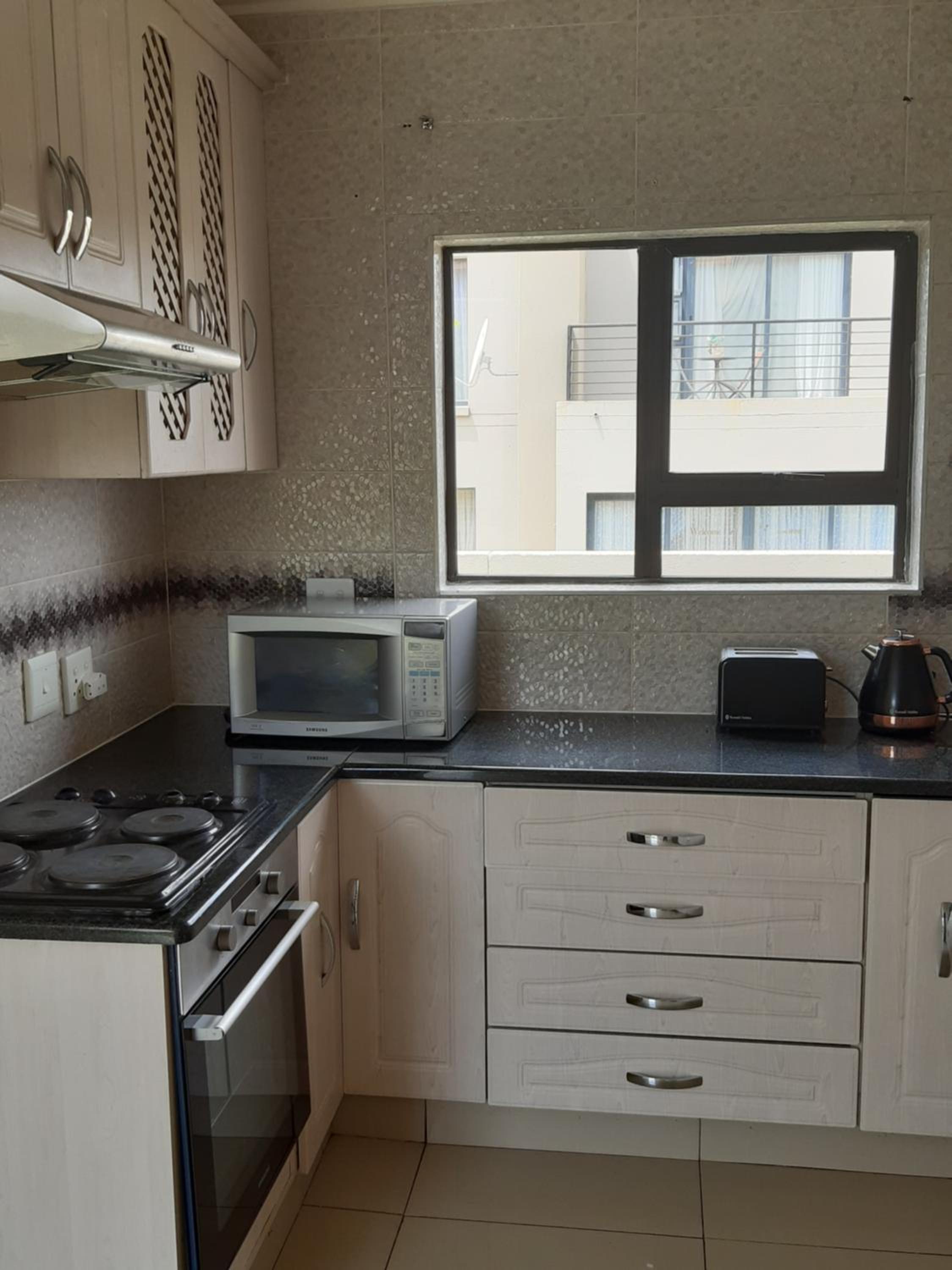 Three-Bedroom House - Photo 34