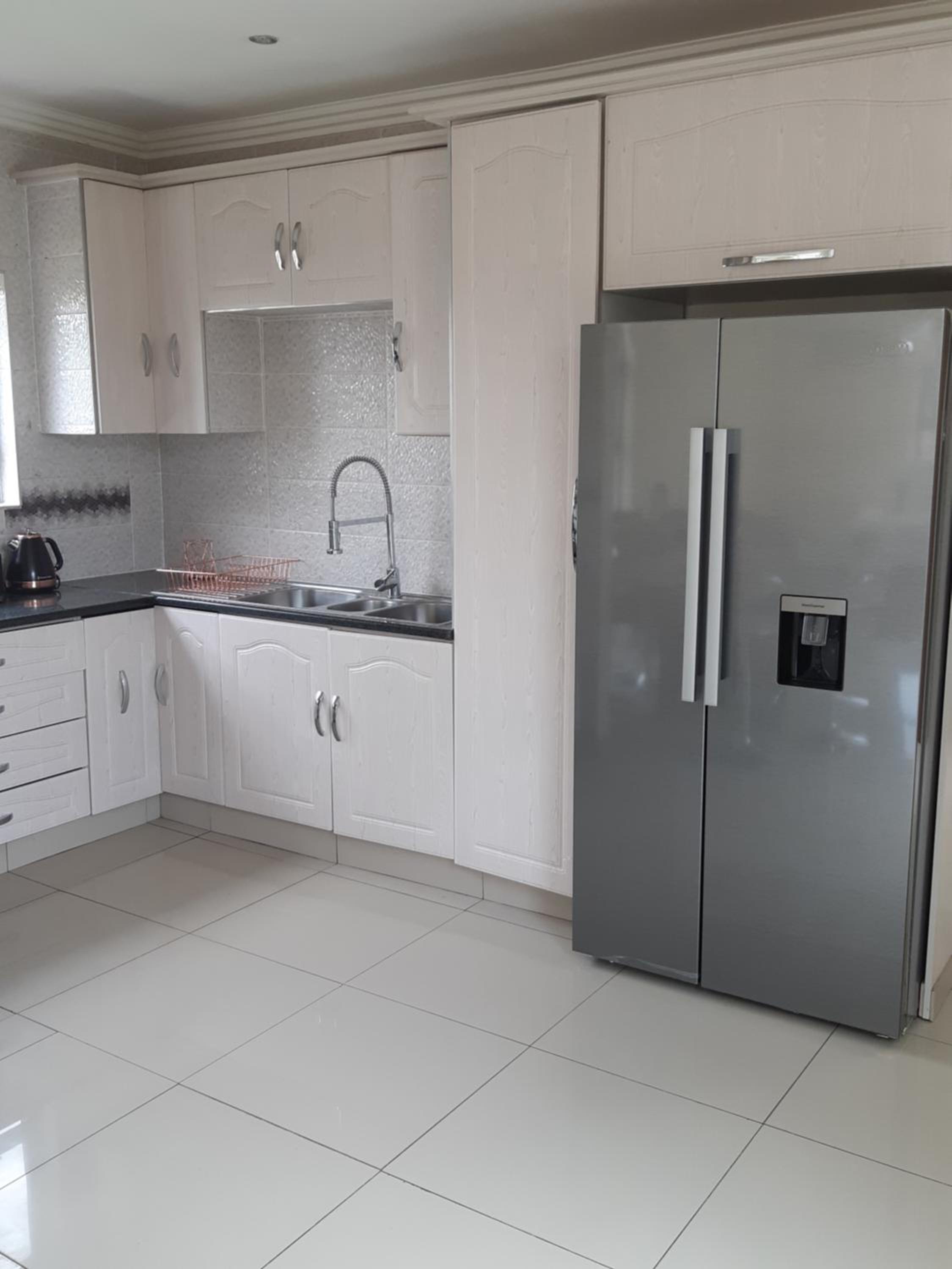 Three-Bedroom House - Photo 35