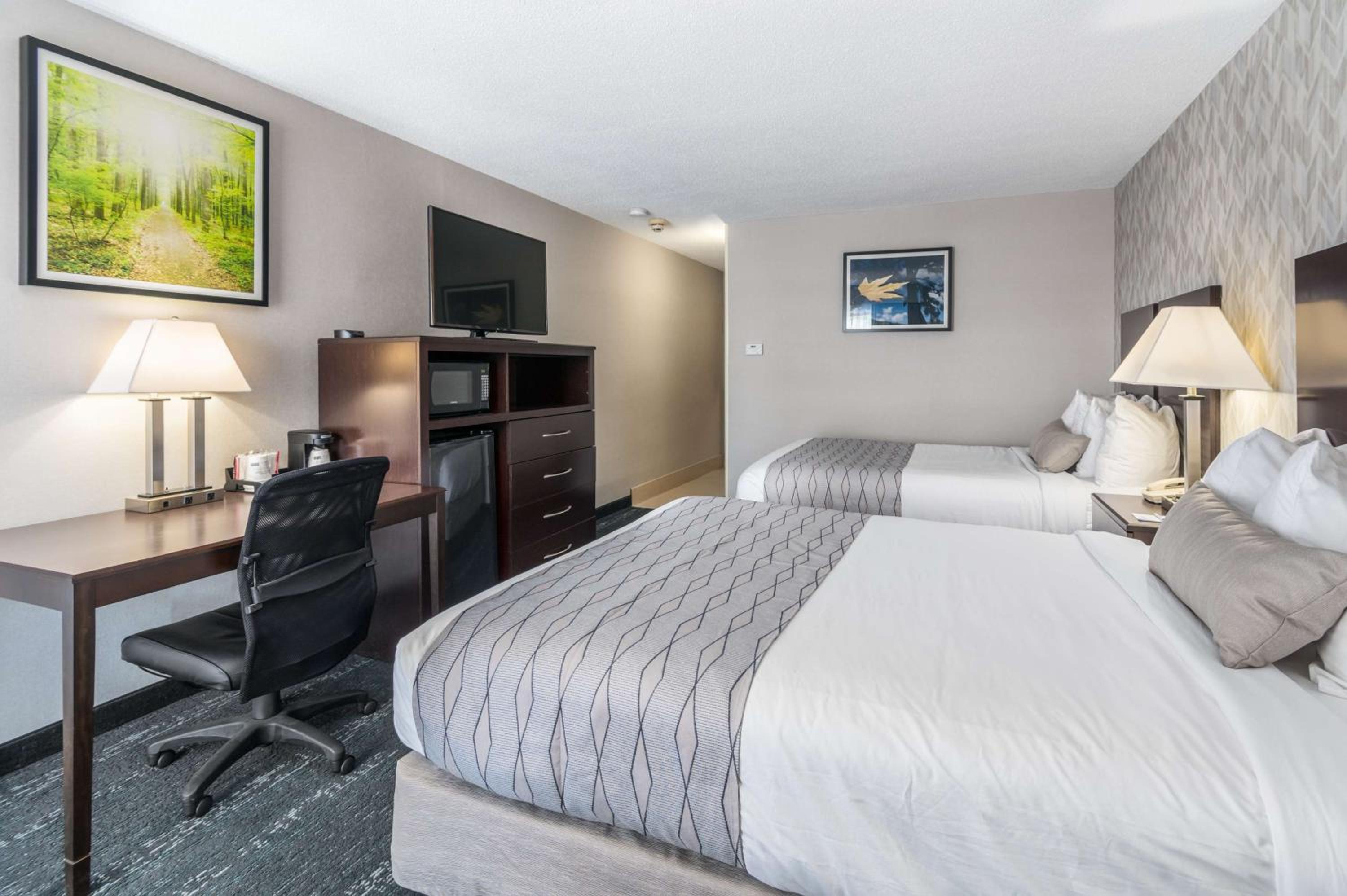 Queen Room with Two Queen Beds and Mobility Accessible Bathtub - Photo 1