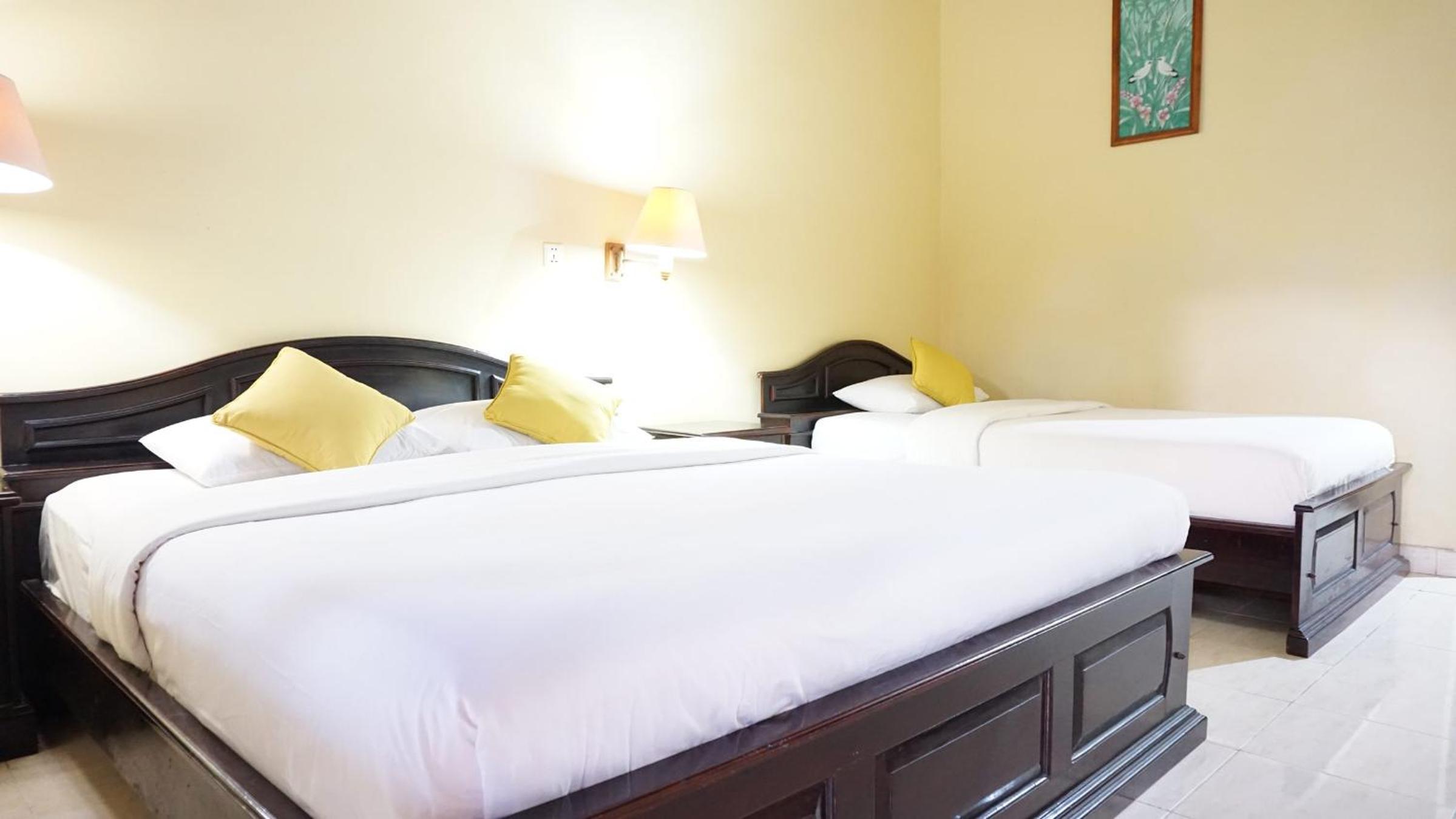 Deluxe Triple Room - Photo 11