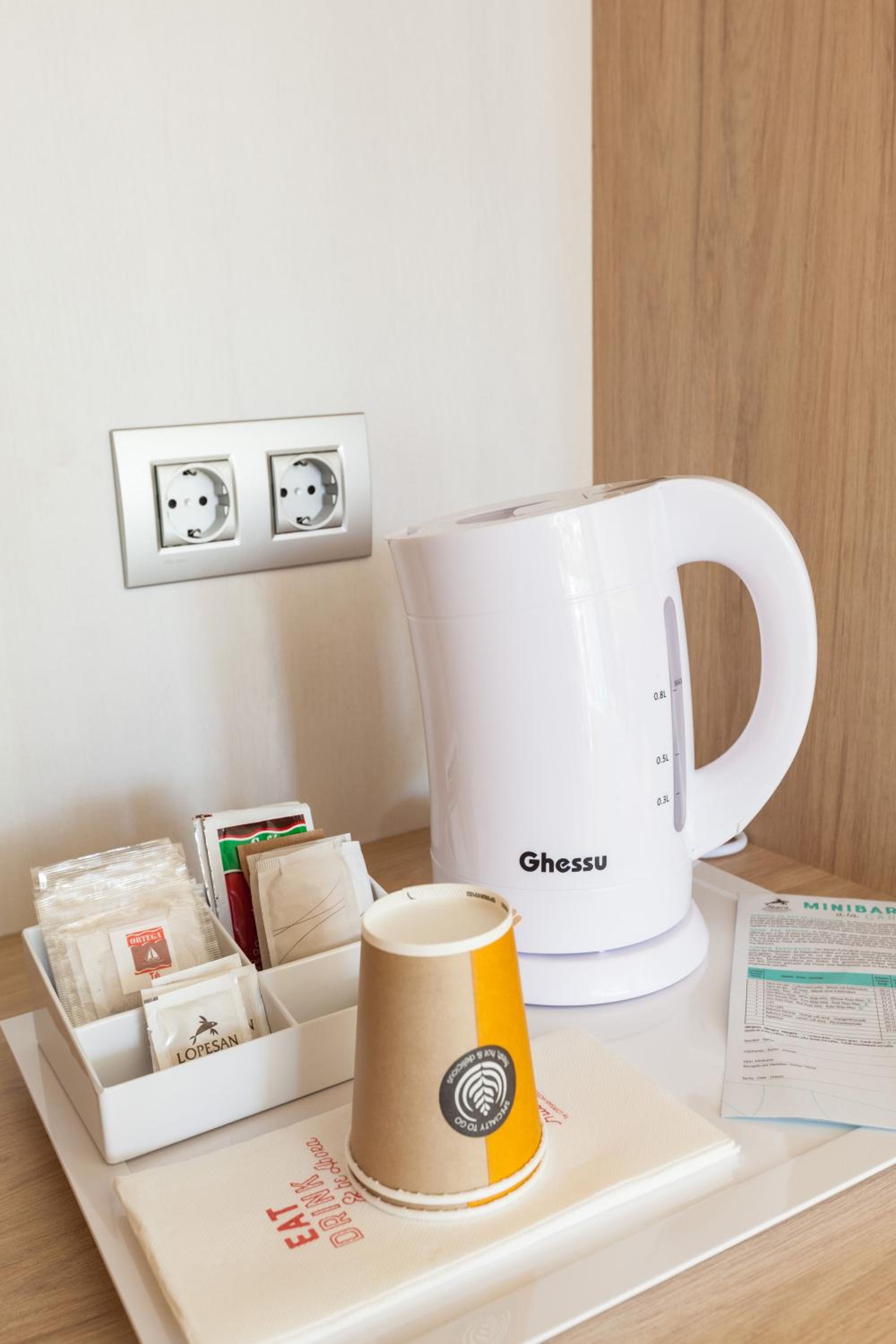 cup of coffee and a toaster on a tray