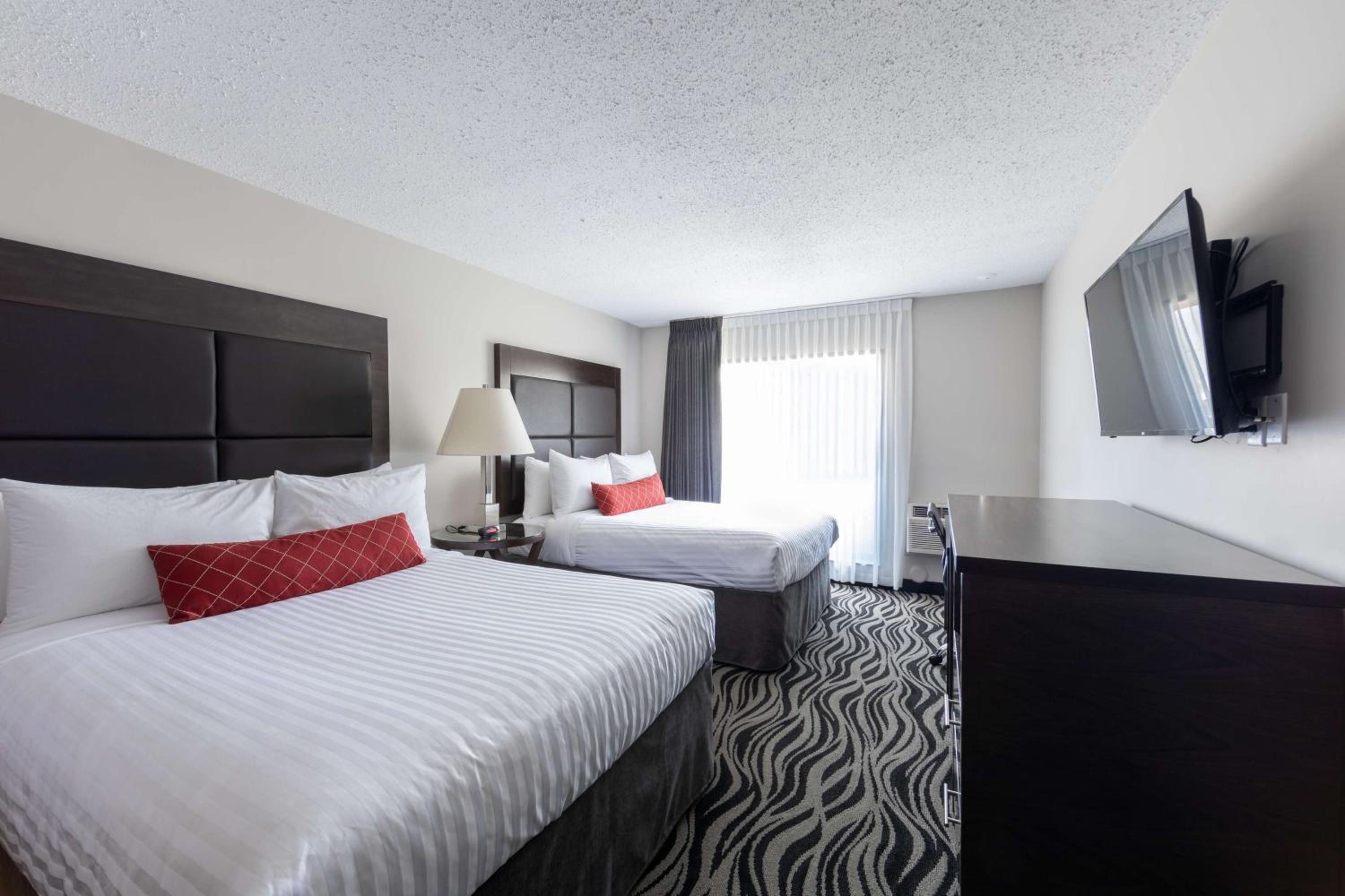 Queen Room with Two Queen Beds and Work Desk - Second Floor/No Pets Allowed/Non-Smoking - Photo 1