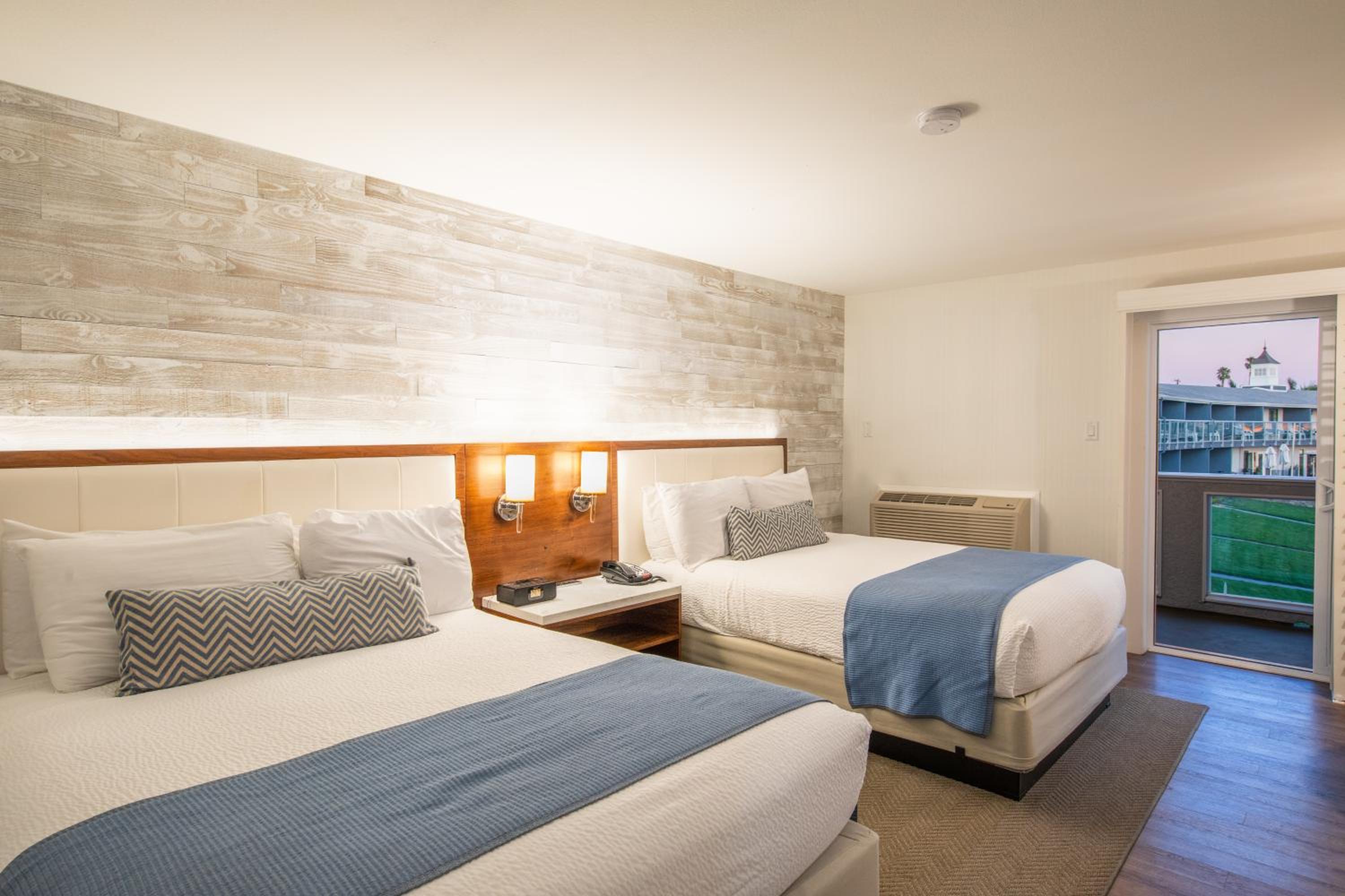 Queen Room with Two Queen Beds and Partial Ocean View - Photo 1