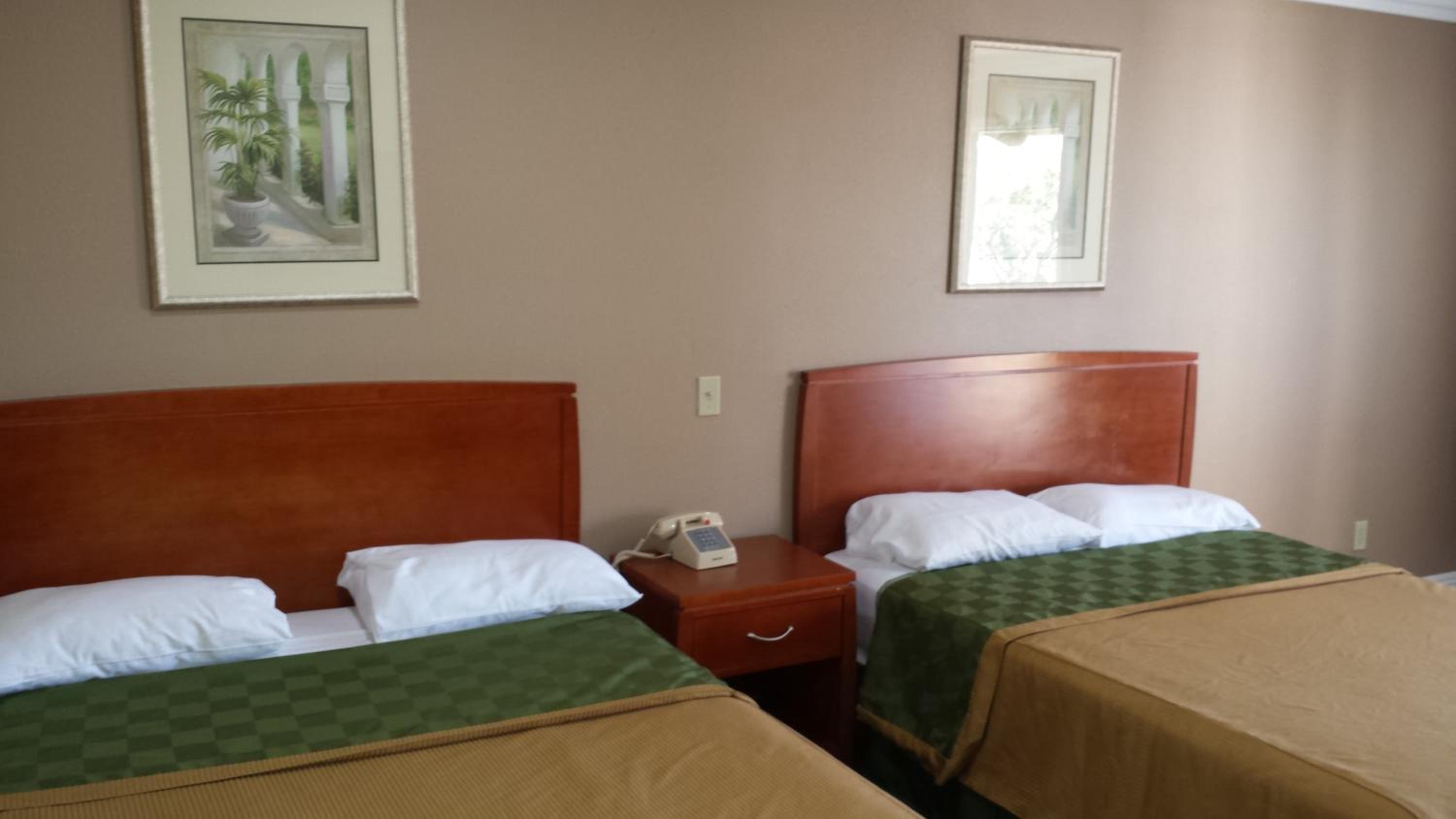 Standard Queen Room with Two Queen Beds - Photo 1