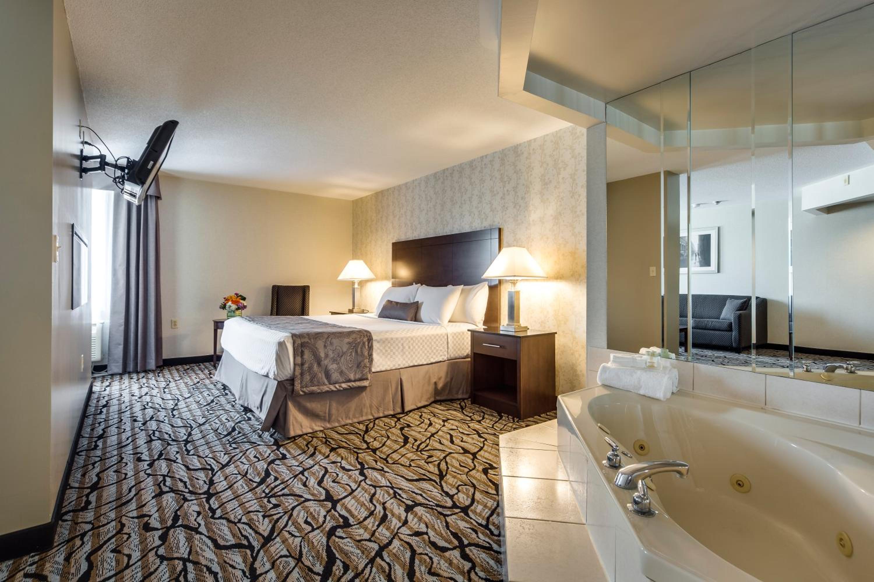 Deluxe King Suite with Jetted Tub and Living Room - Photo 2