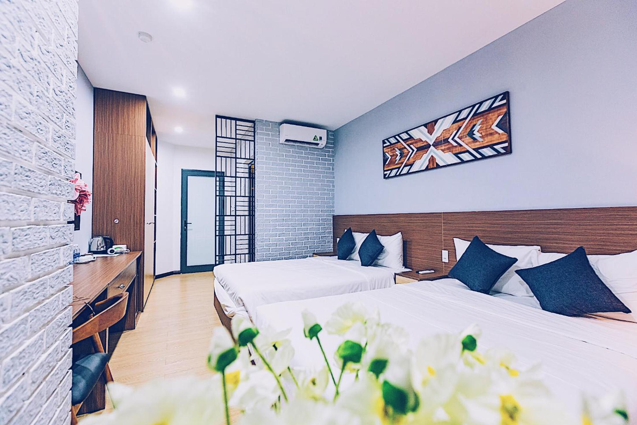 Deluxe Quadruple Room - Photo 3