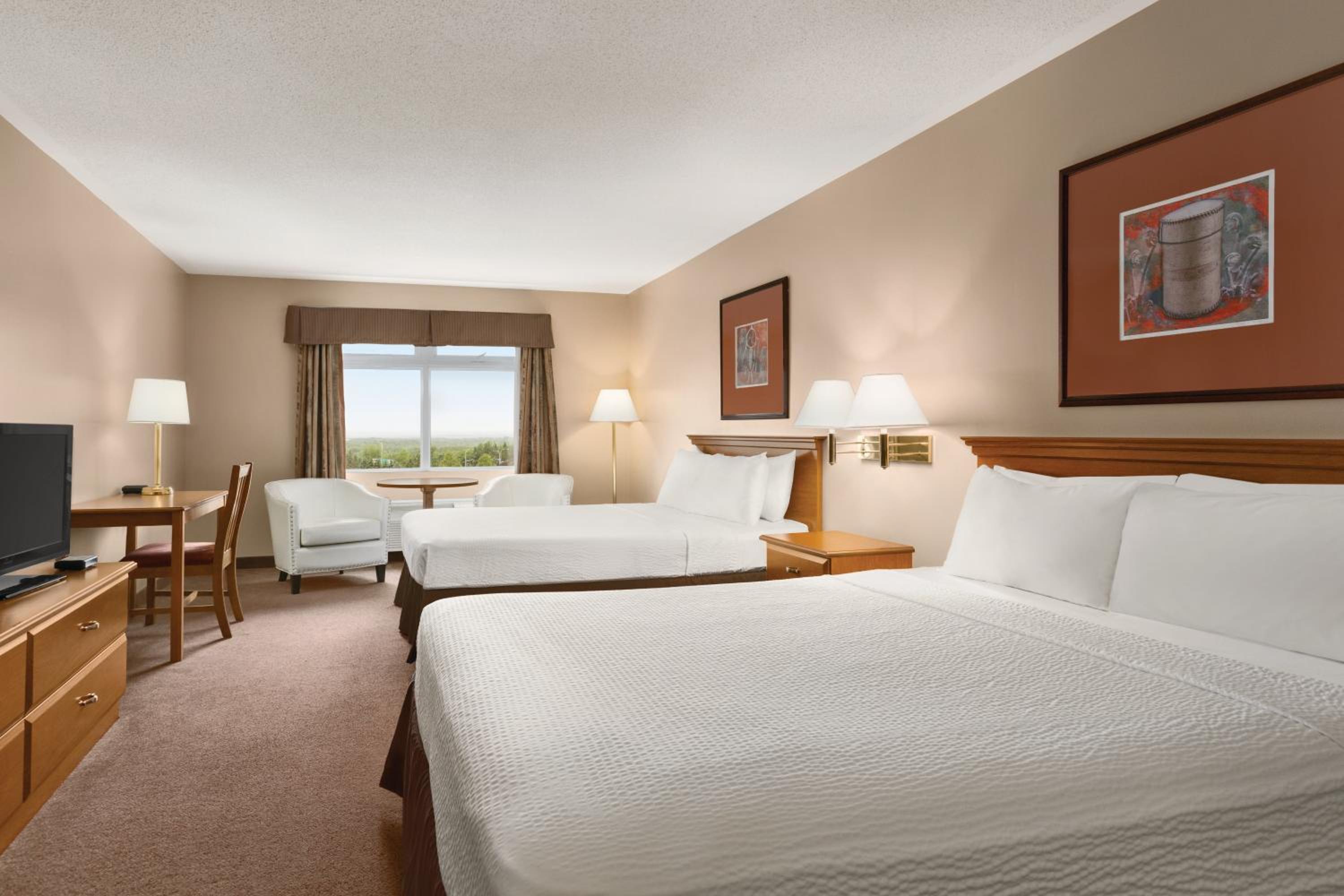 Deluxe Queen Room with Two Queen Beds - Non-Smoking photo 1