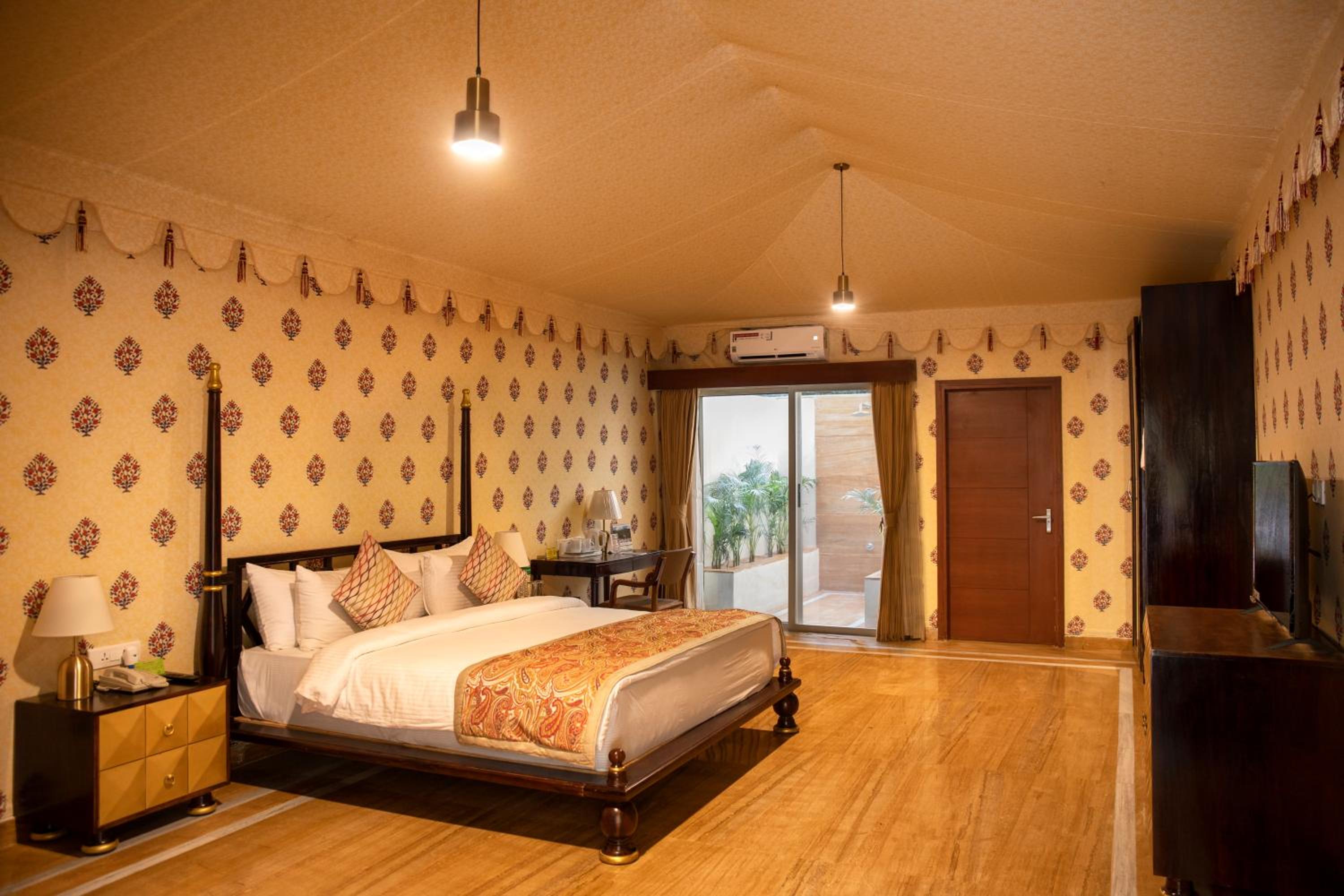 Premium Tent:10% discount on Food & Beverages (excluding In-Room Dining and Liquor), 10% discount on Spa Services, Laundry Services, Complimentary Happy Hour Offer – Buy 1 Get 1 Free, available daily from 11:00 AM to 7:00 PM. - Photo 1