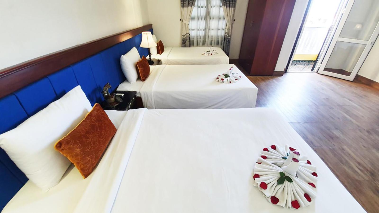 Deluxe Triple Room - Photo 9