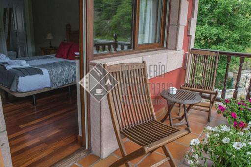 Habitación King con Balcón