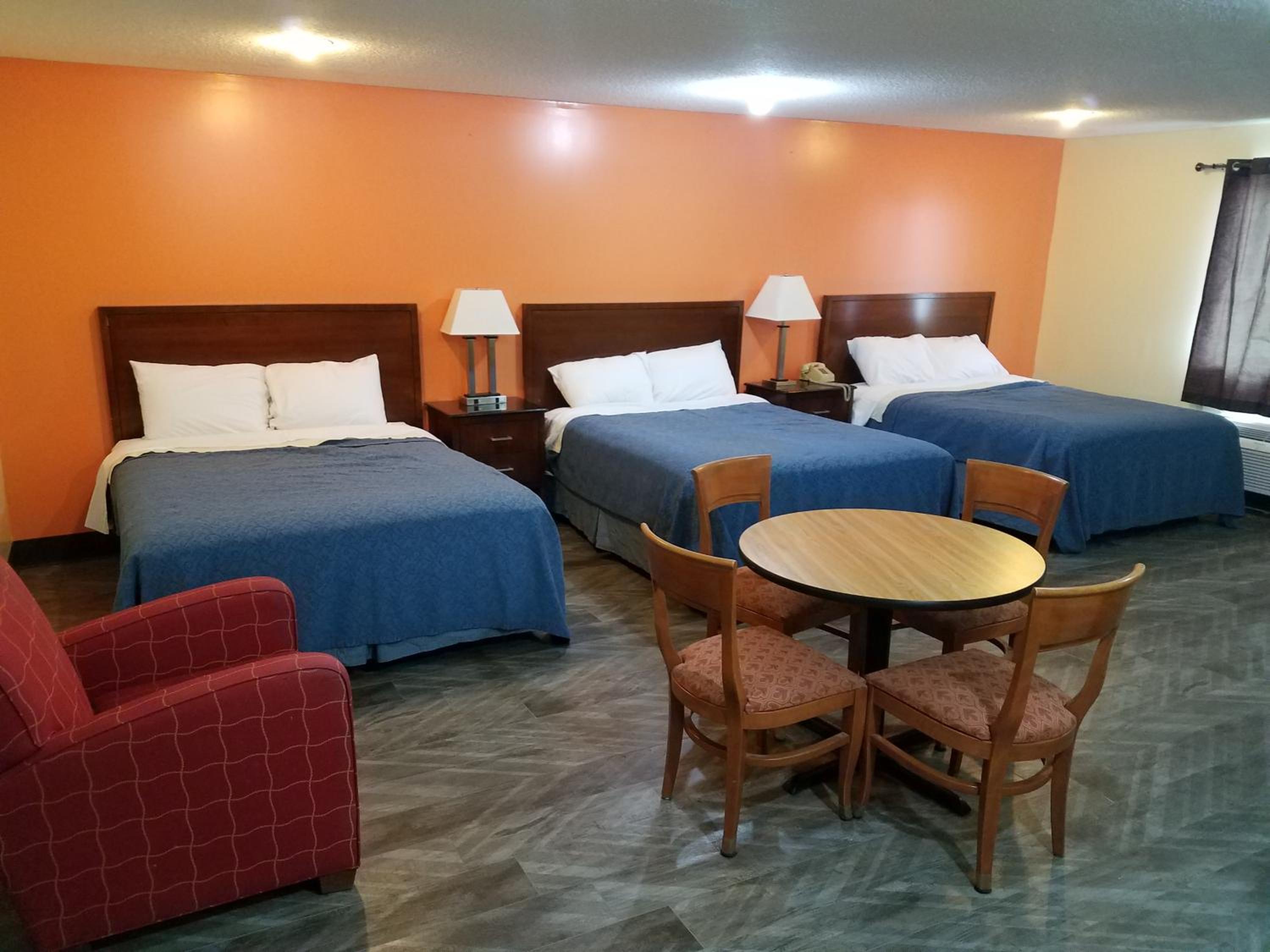 Queen Room with Three Queen Beds - Photo 1