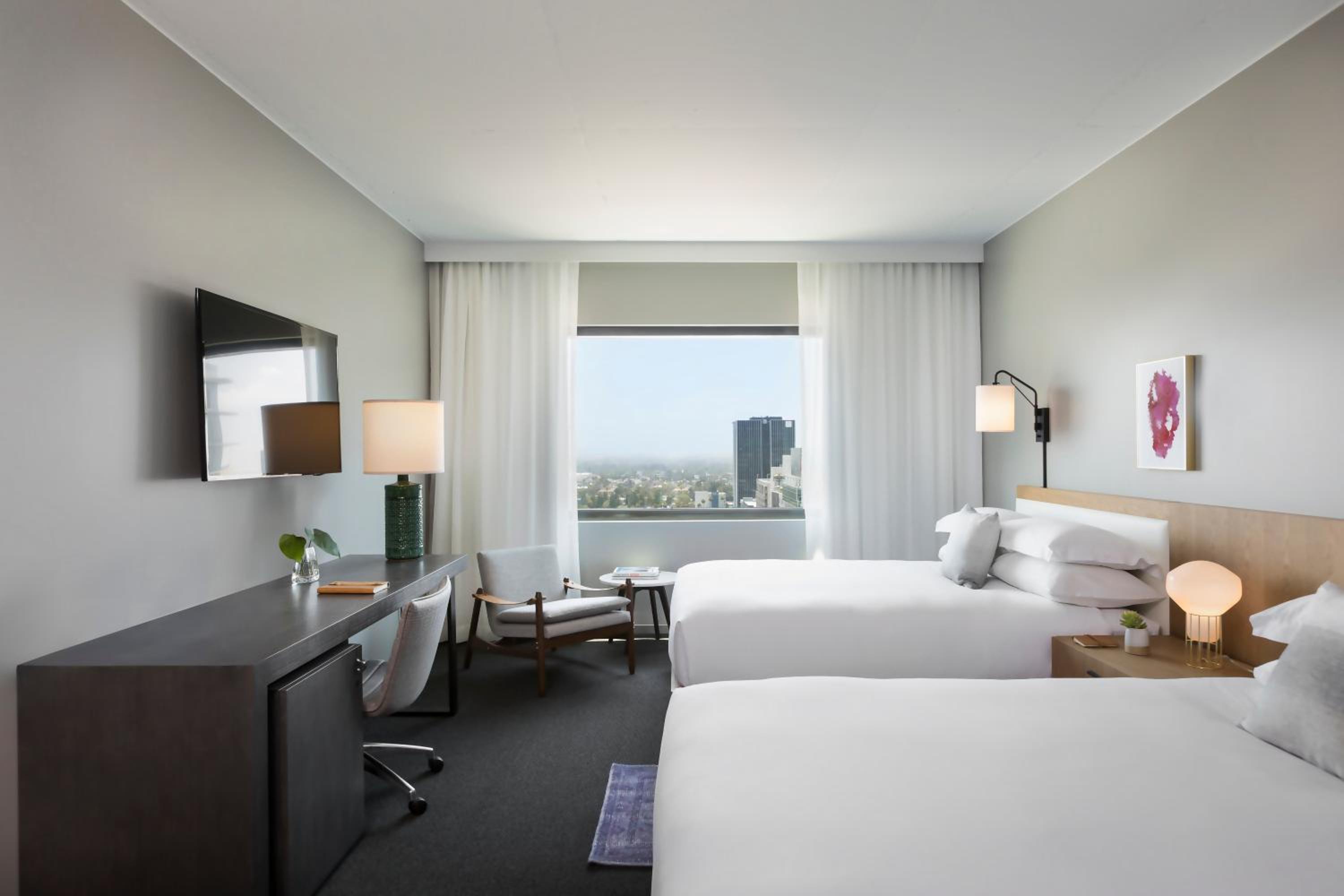 Essential Queen Room with Two Queen Beds and City View