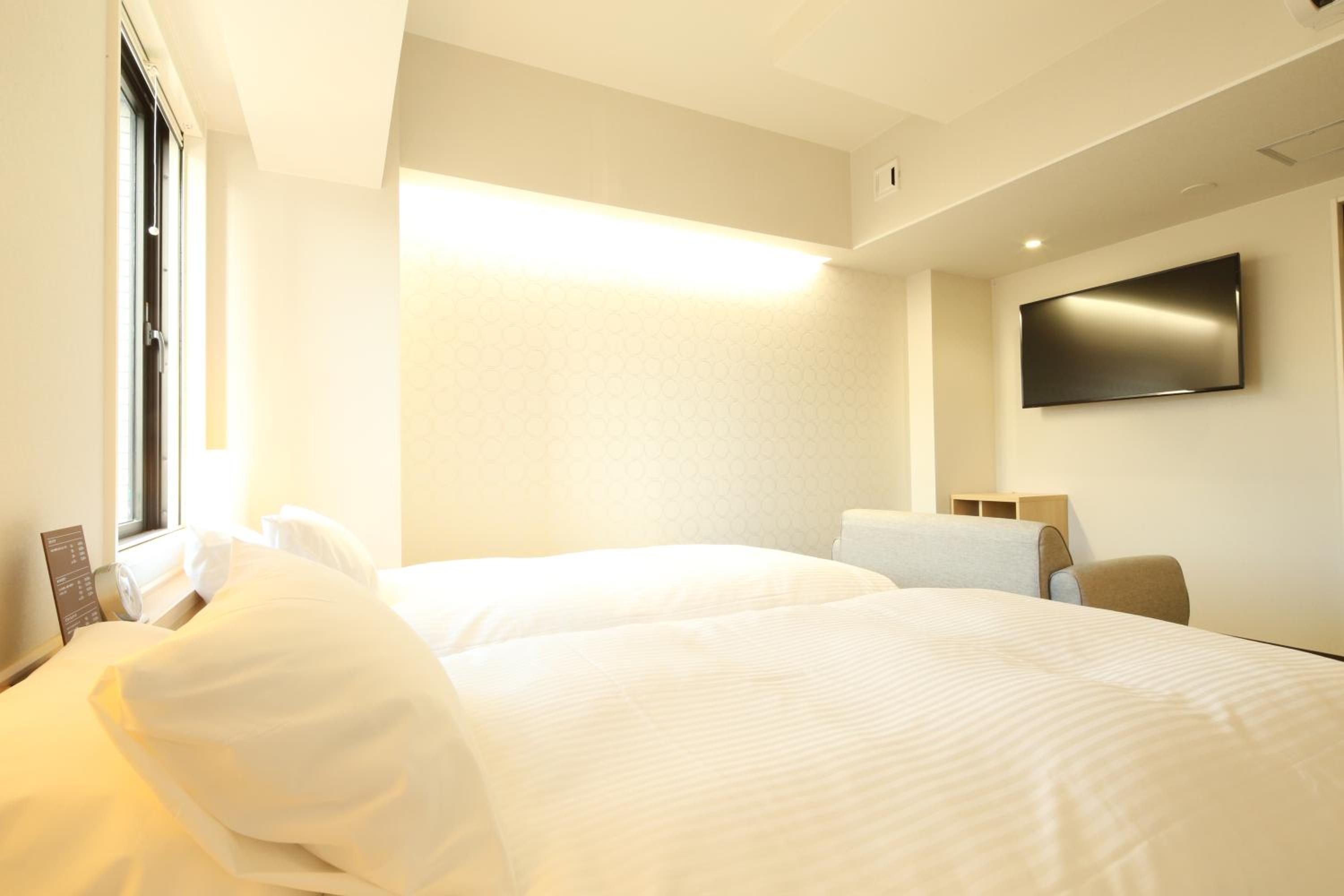 Universal Twin Room - Non-Smoking - Photo 1