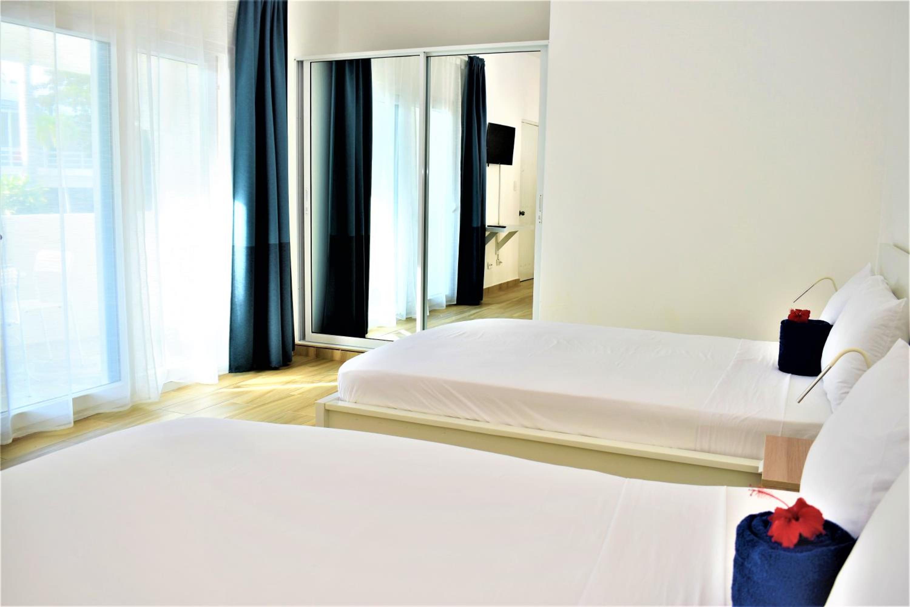 Two-bed pool view room without kitchen