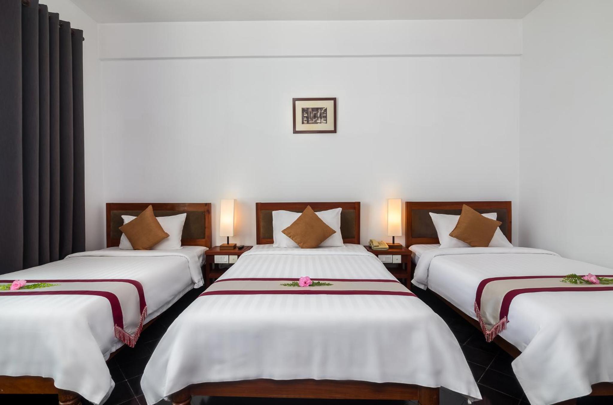 Deluxe Triple Room - Photo 10