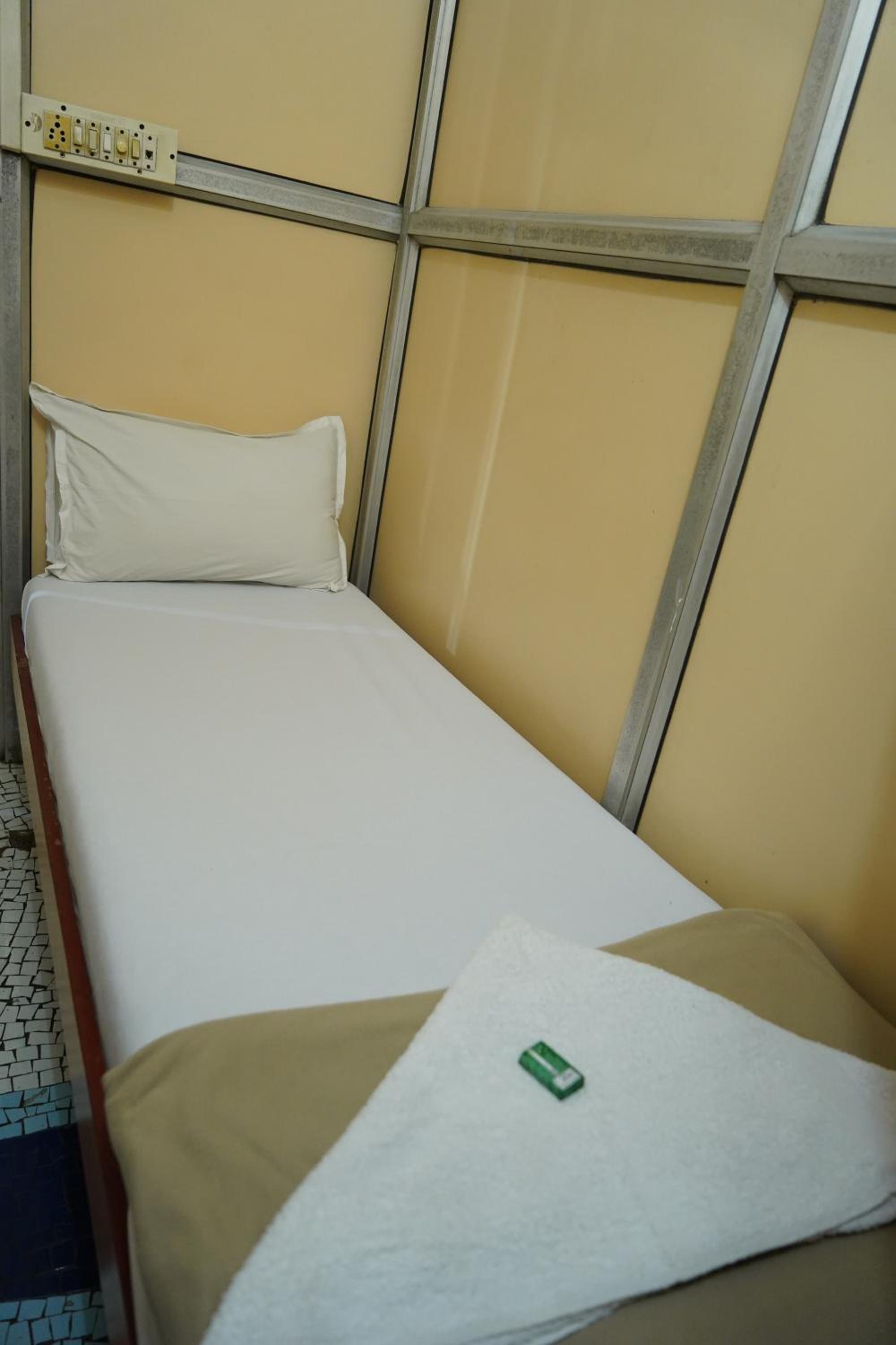 Single Bed In Dormitory Room