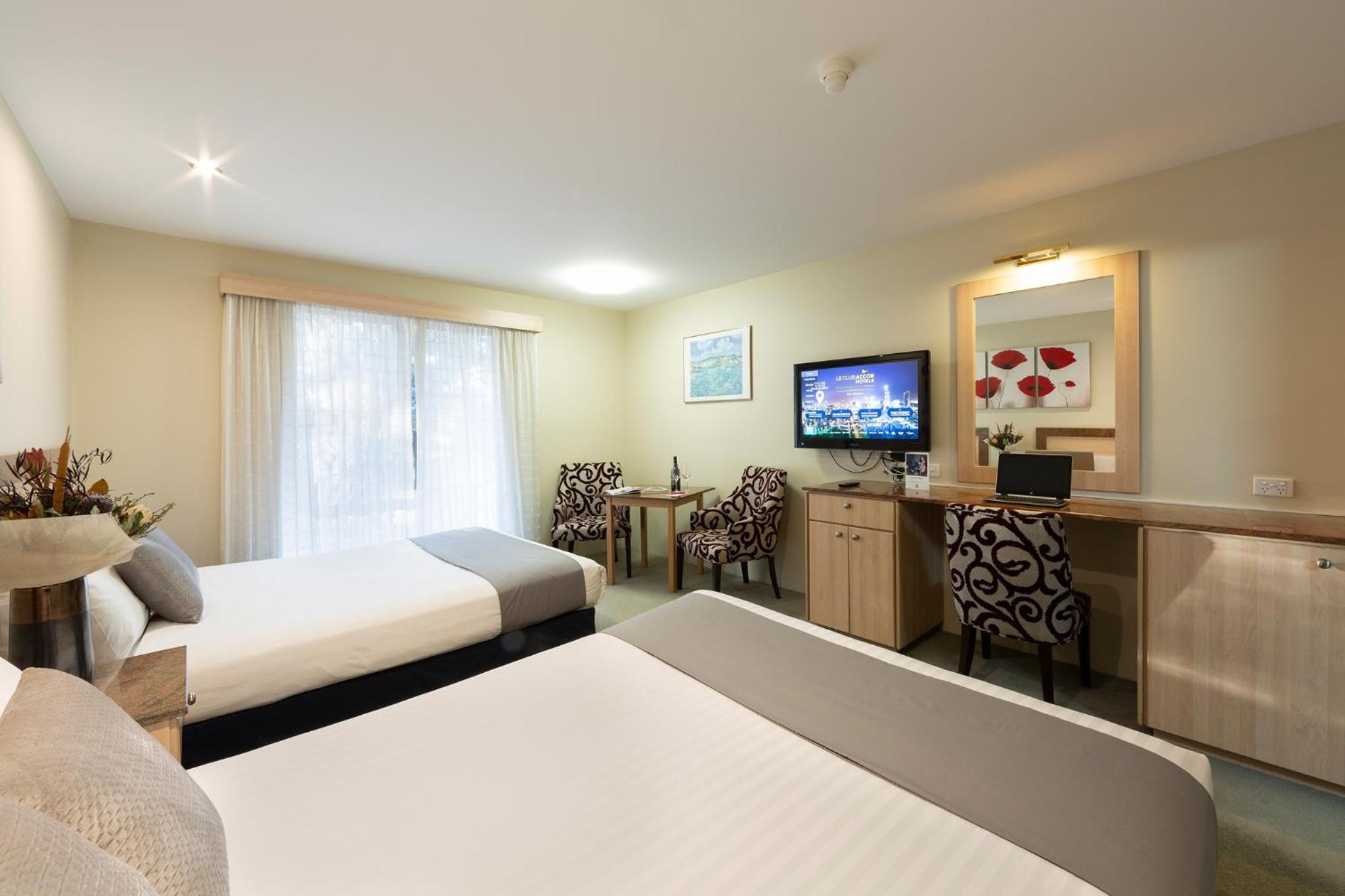 Superior Queen Room with Two Queen Beds - Photo 1