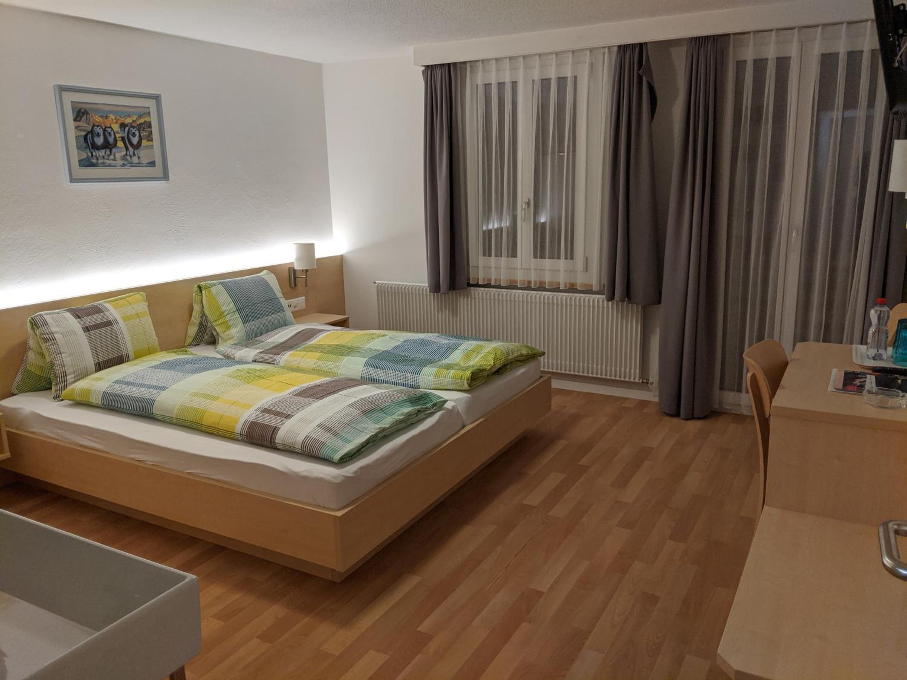 Family Room (2 Adults + 2 Children) with Balcony and Mountain View photo 1