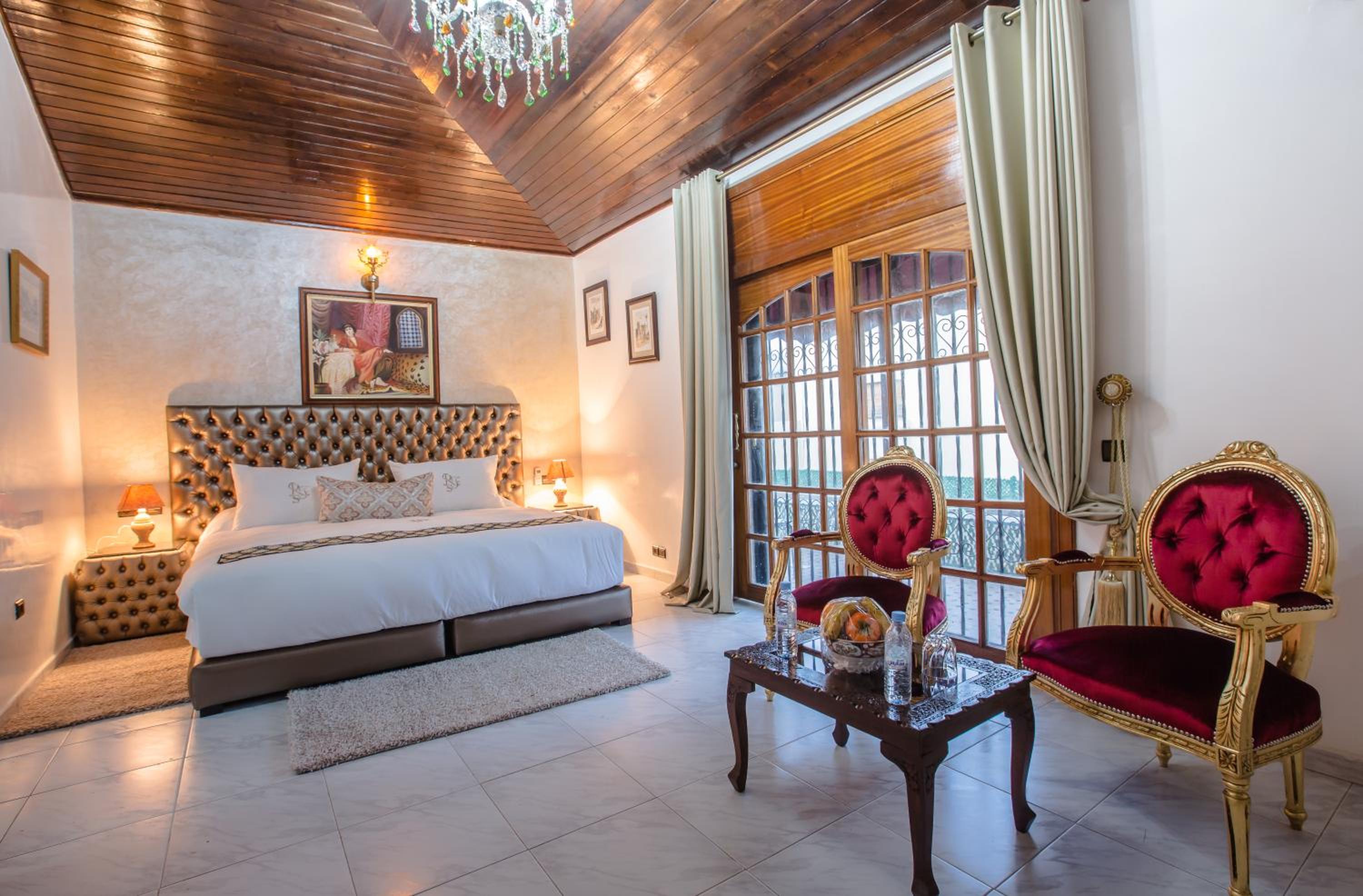 King Suite with Balcony - Photo 1