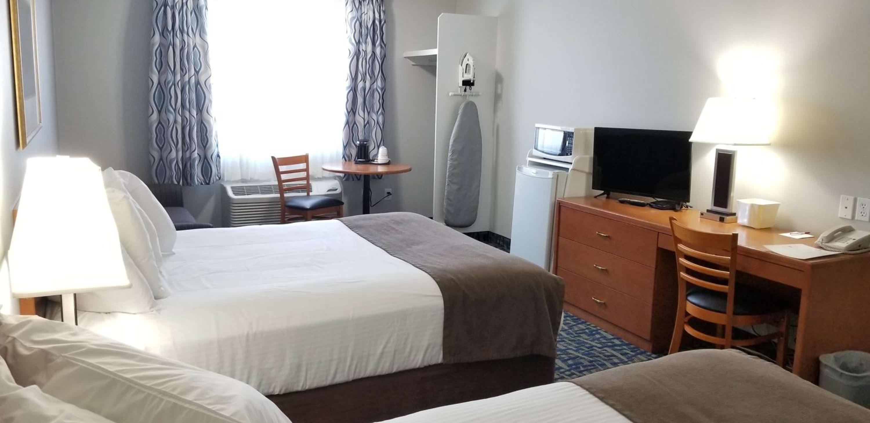 Queen Room with Two Queen Beds and Sofa - Photo 8