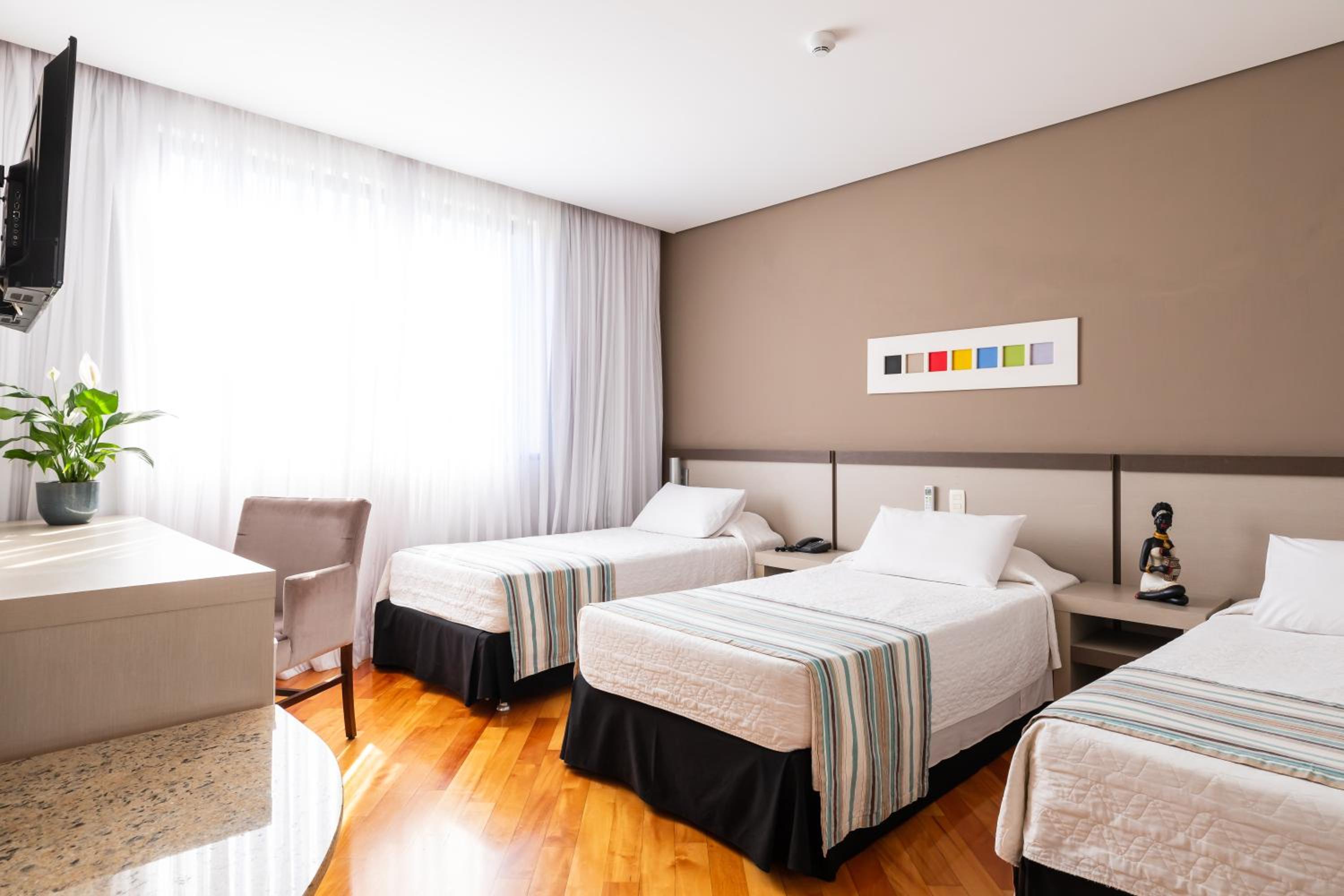 Deluxe Triple Room - Photo 17