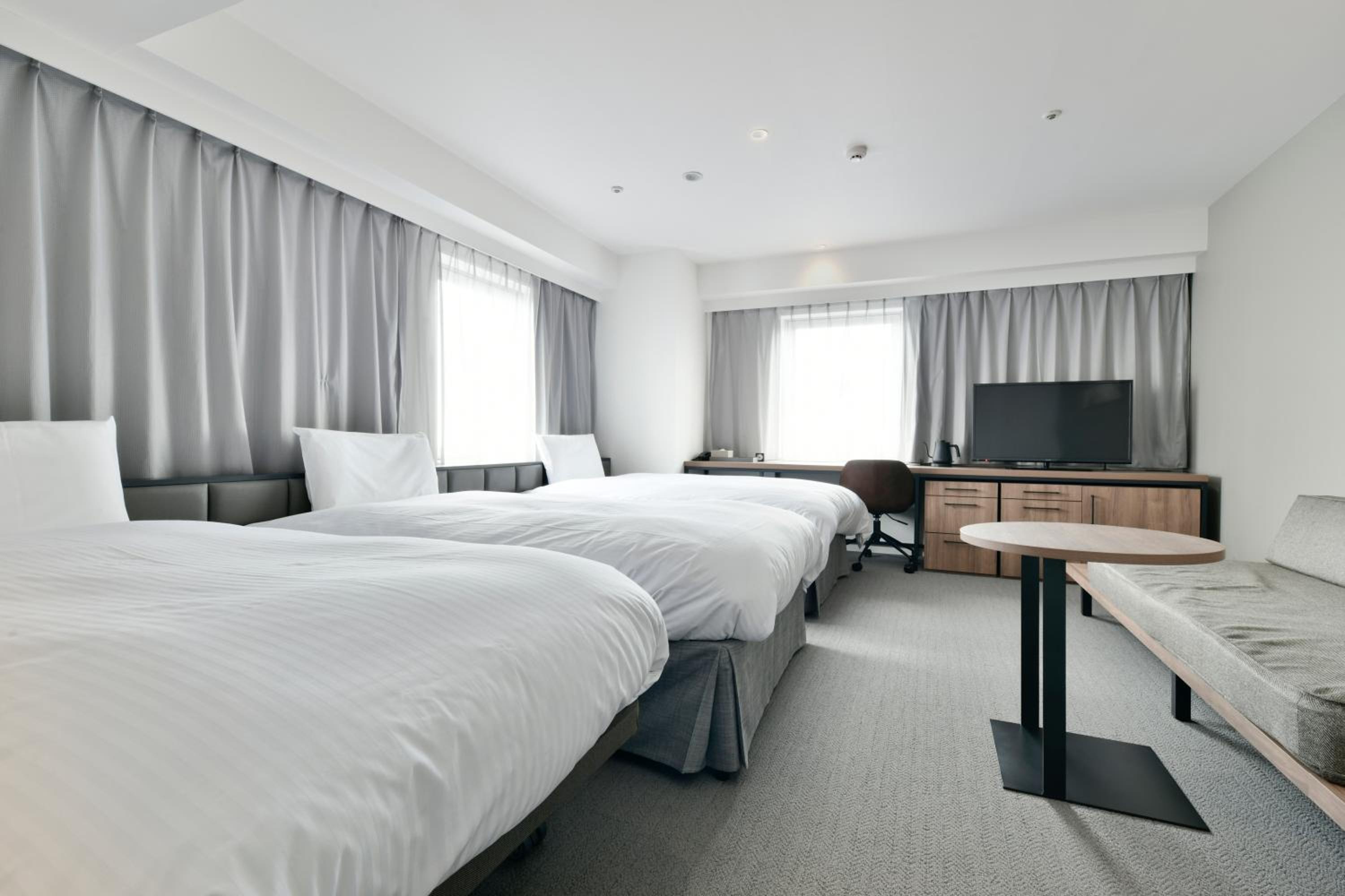 Deluxe Twin Room with 1 Extra Bed - Photo 1