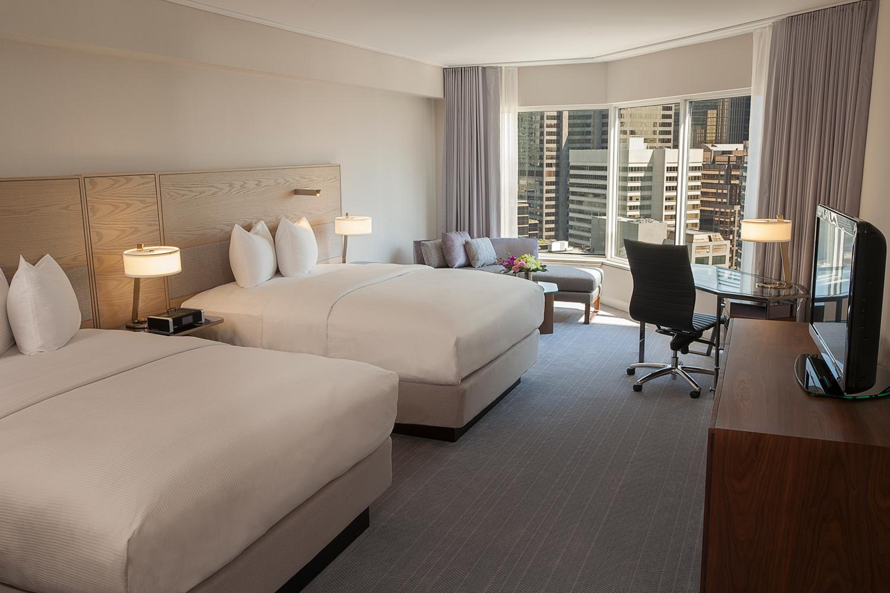 Premium Queen Room With Two Queen Beds - Photo 1