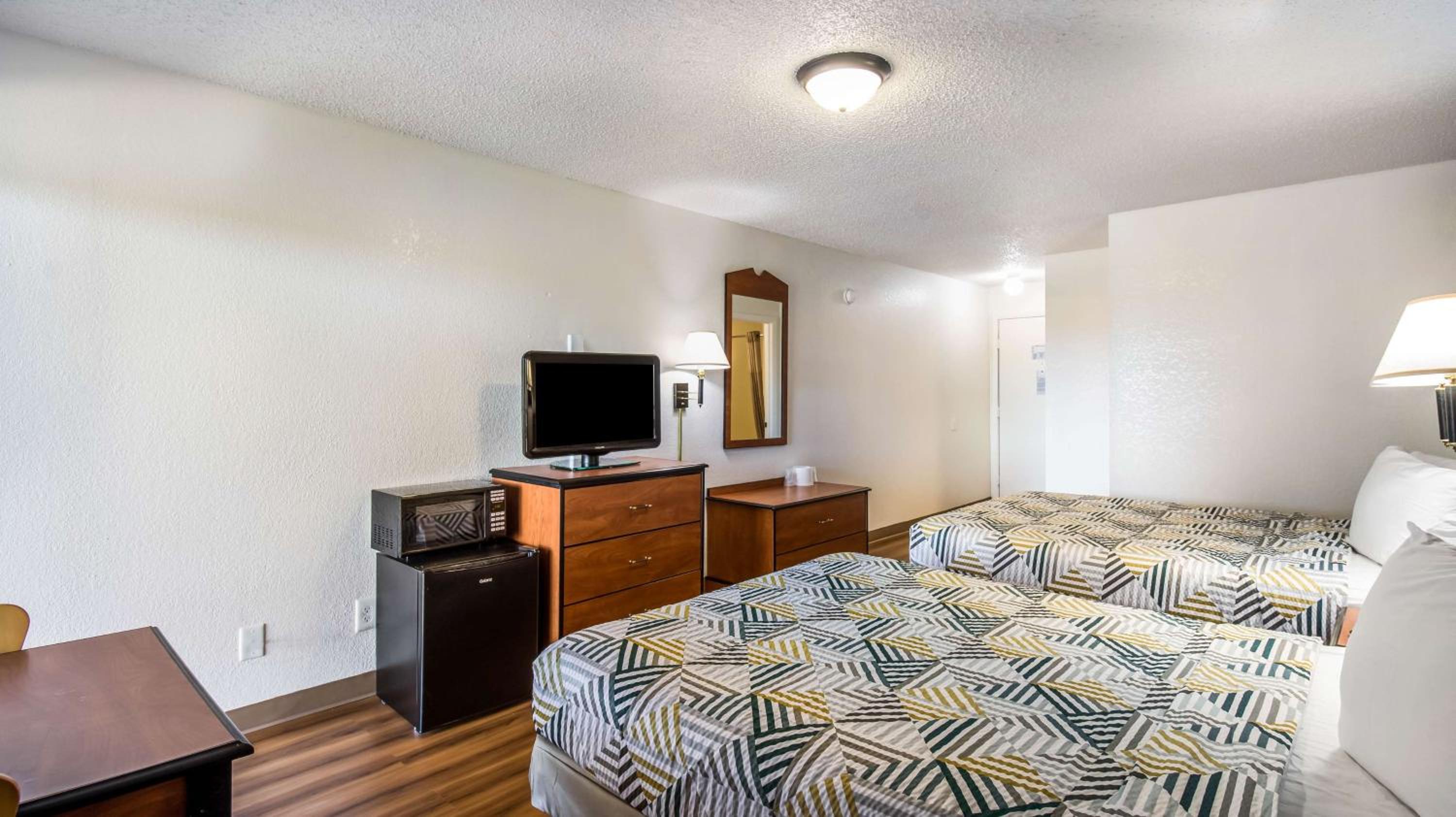 Deluxe Queen Room with Two Queen Beds - Smoking - Photo 1