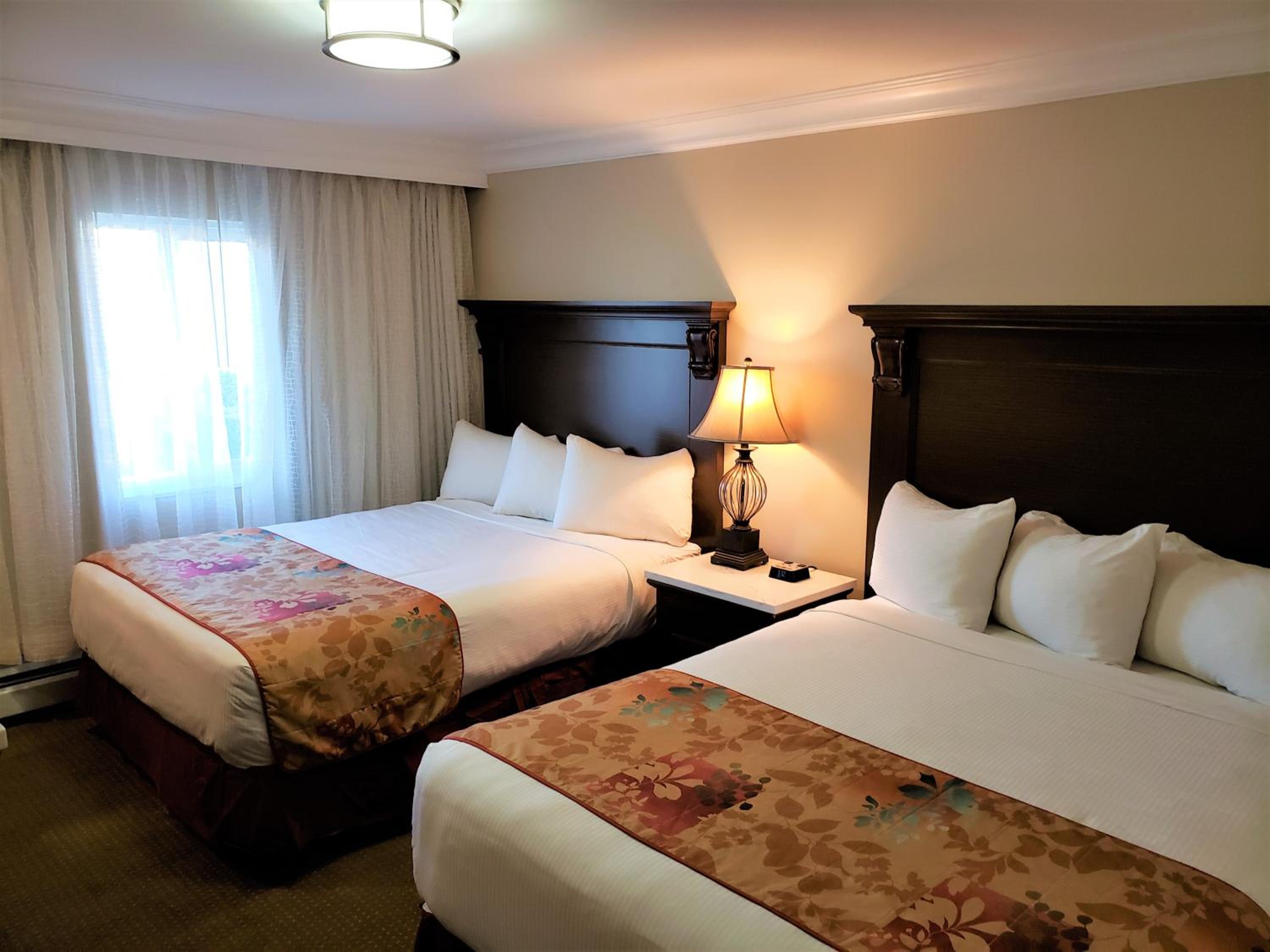Queen Room with Two Queen Beds - Photo 1