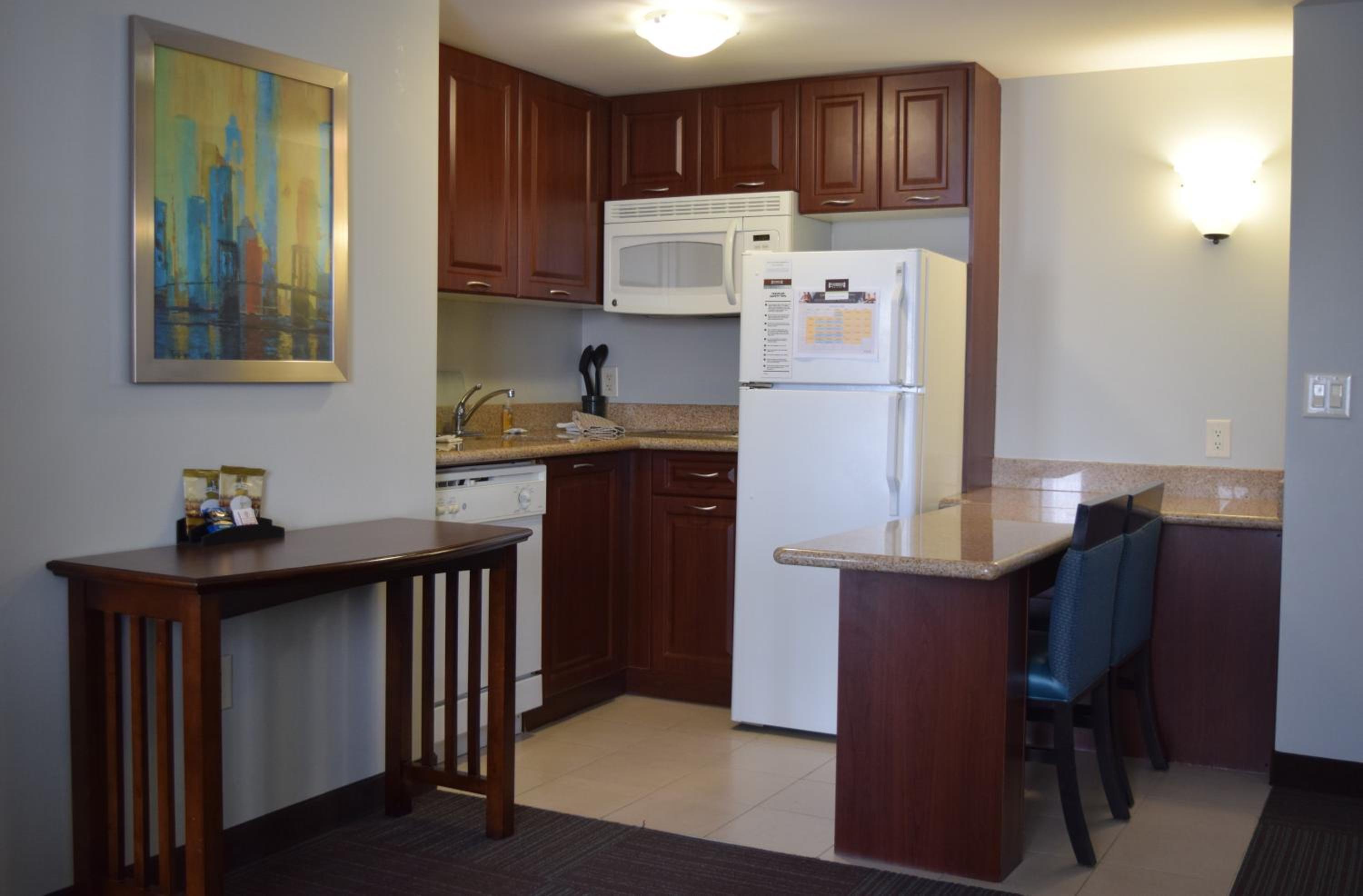 kitchen with a table and chairs in front of it