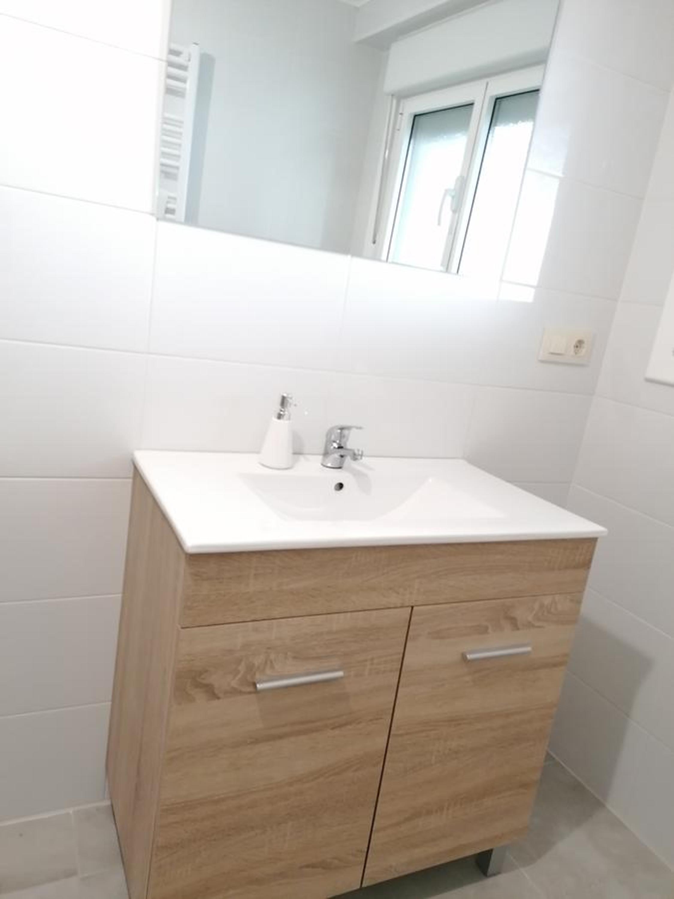 Three-Bedroom Apartment - Photo 9