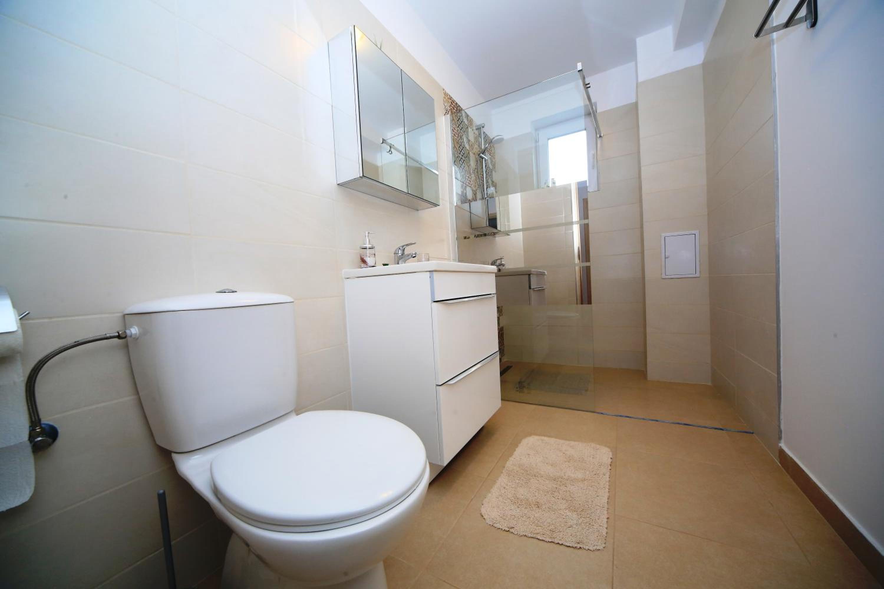 Three-Bedroom House - Photo 24