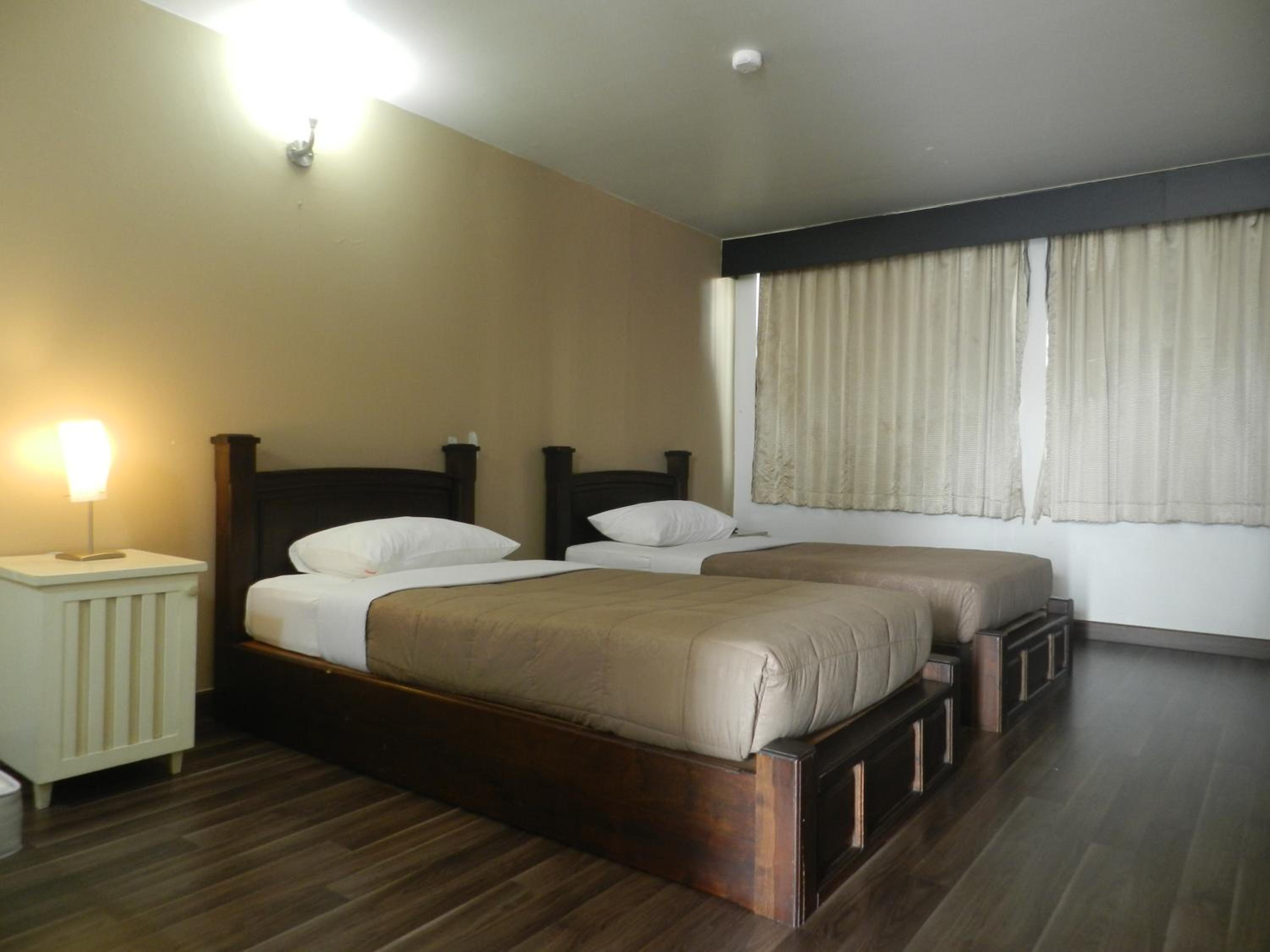 Standard Queen Room with Two Queen Beds photo 1
