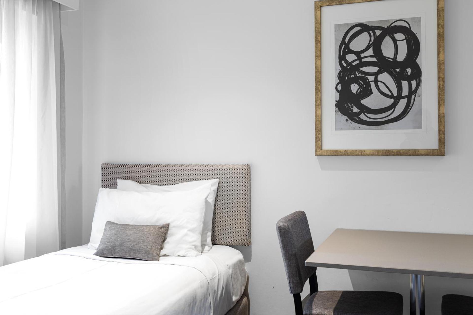 Deluxe Family Room with One Queen Bed and Two Single Beds - Photo 1