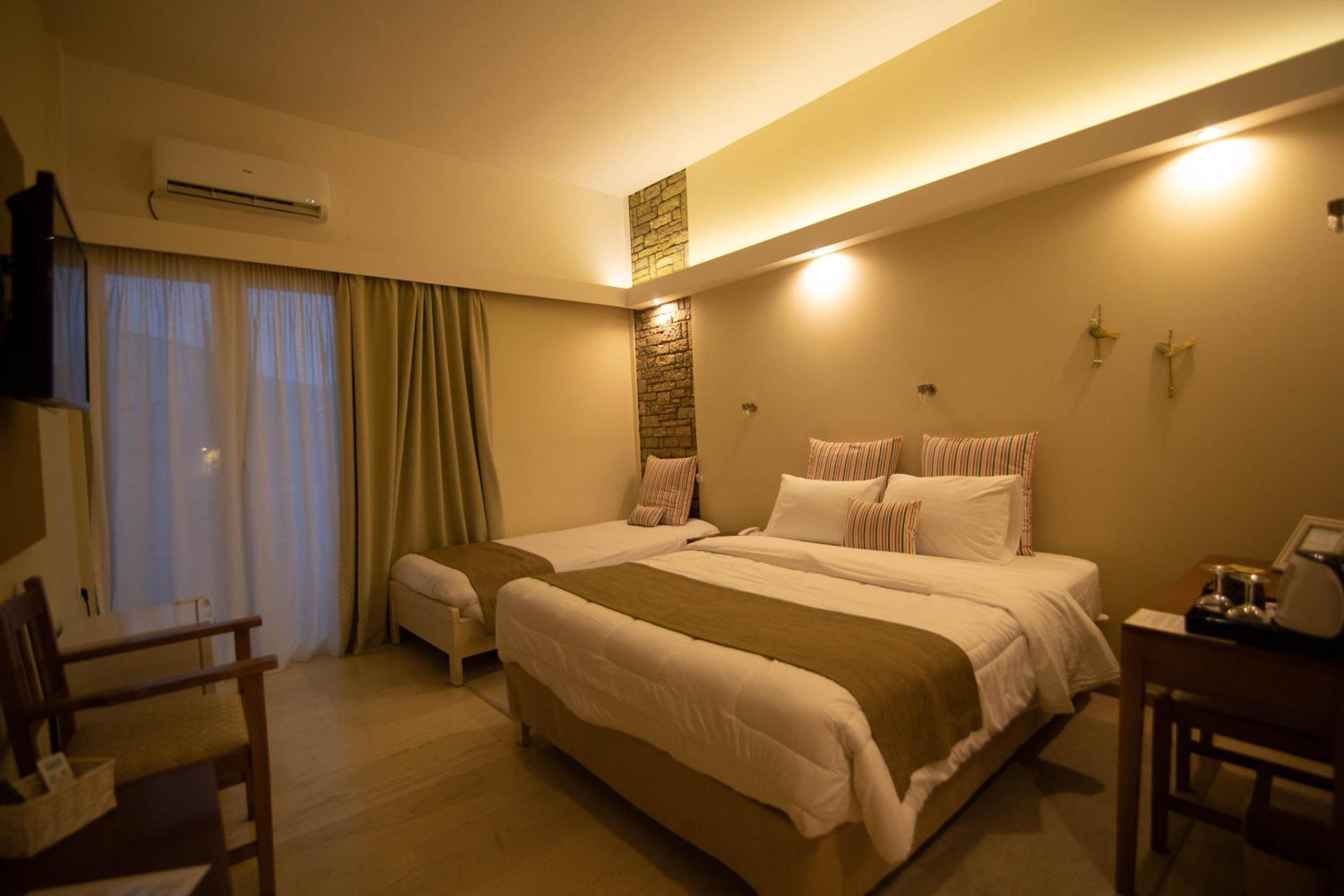 Chambre Triple avec Balcon et Vue sur le Jardin