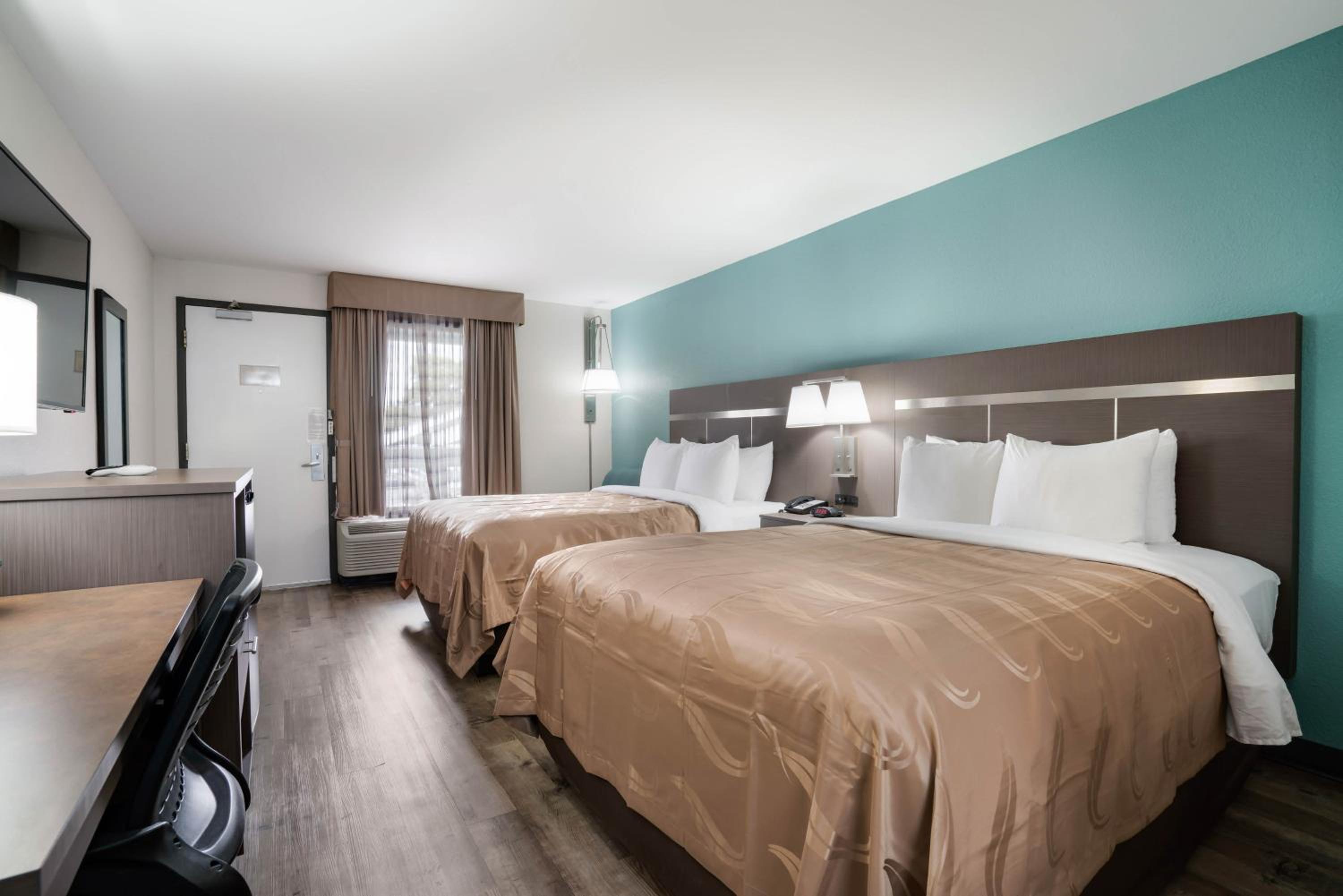 Queen Room with Two Queen Beds - Smoking - Photo 1