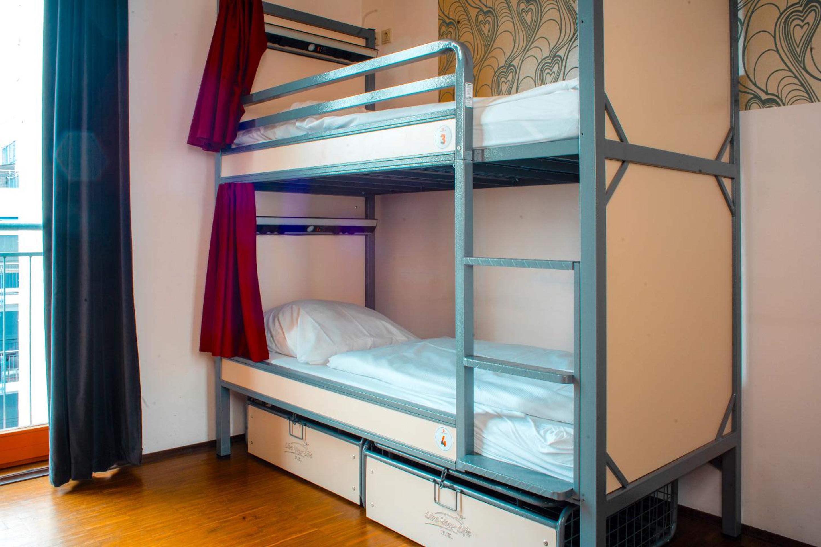Bed in 8-Bed Dormitory Room with Private Bathroom