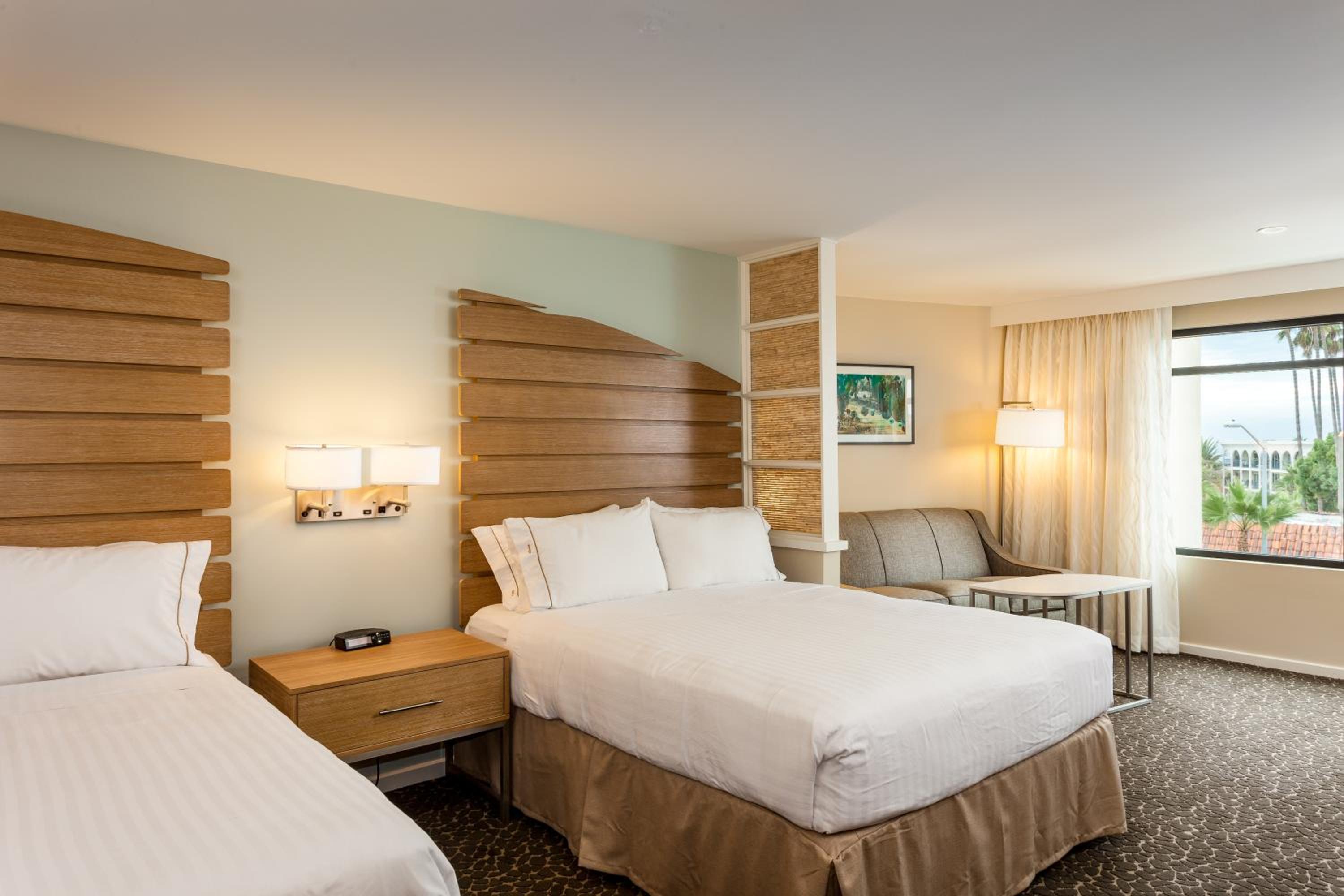 Queen Suite with Two Queen Beds and Sofa Bed - Photo 1