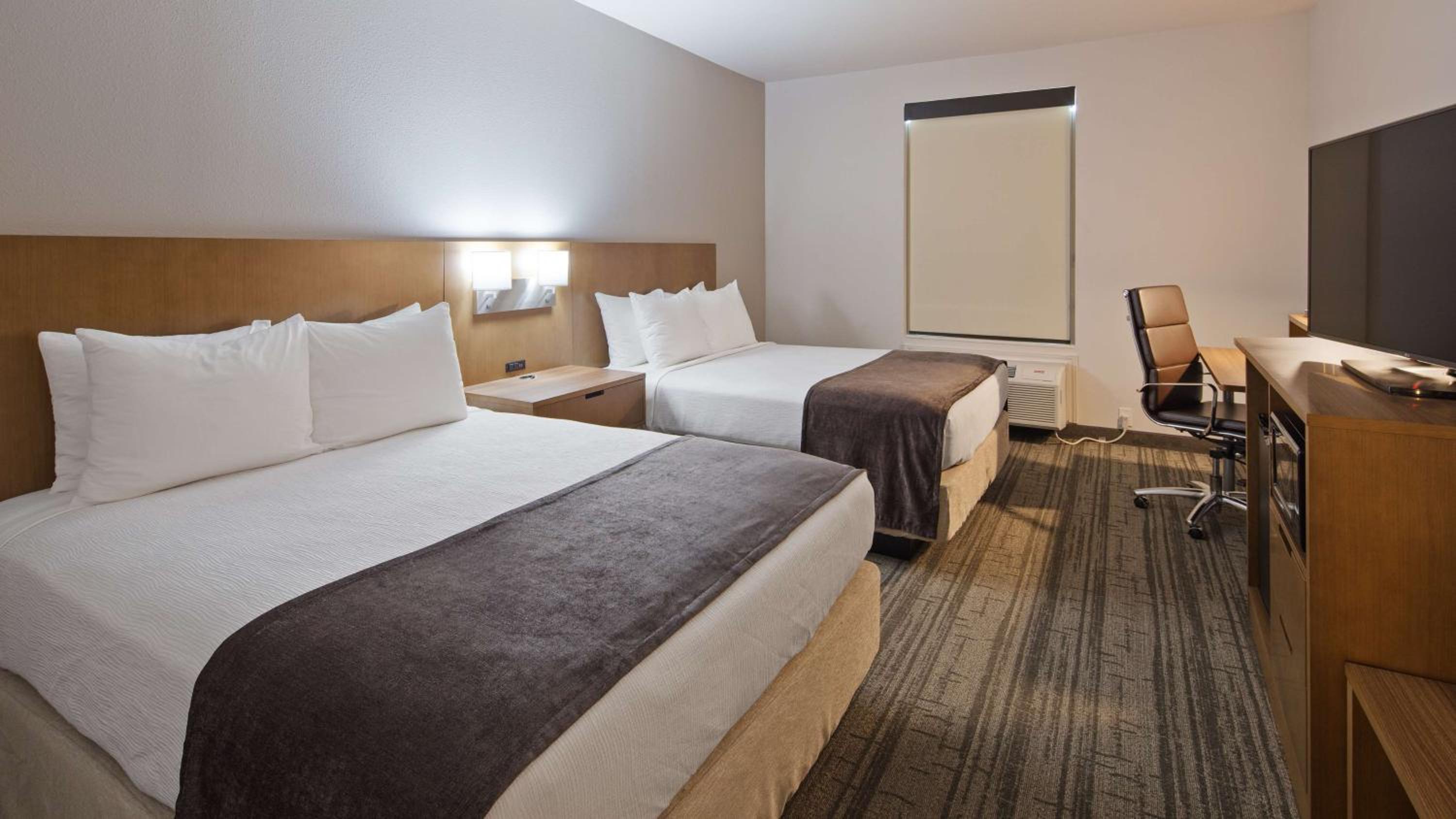 Queen Room with Two Queen Beds - Photo 1